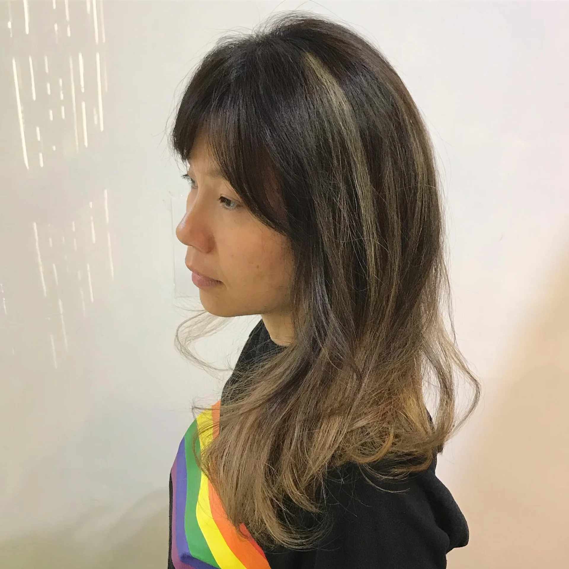 Modern shag haircut with curtain bangs, a popular trend in NYC - Preview 3