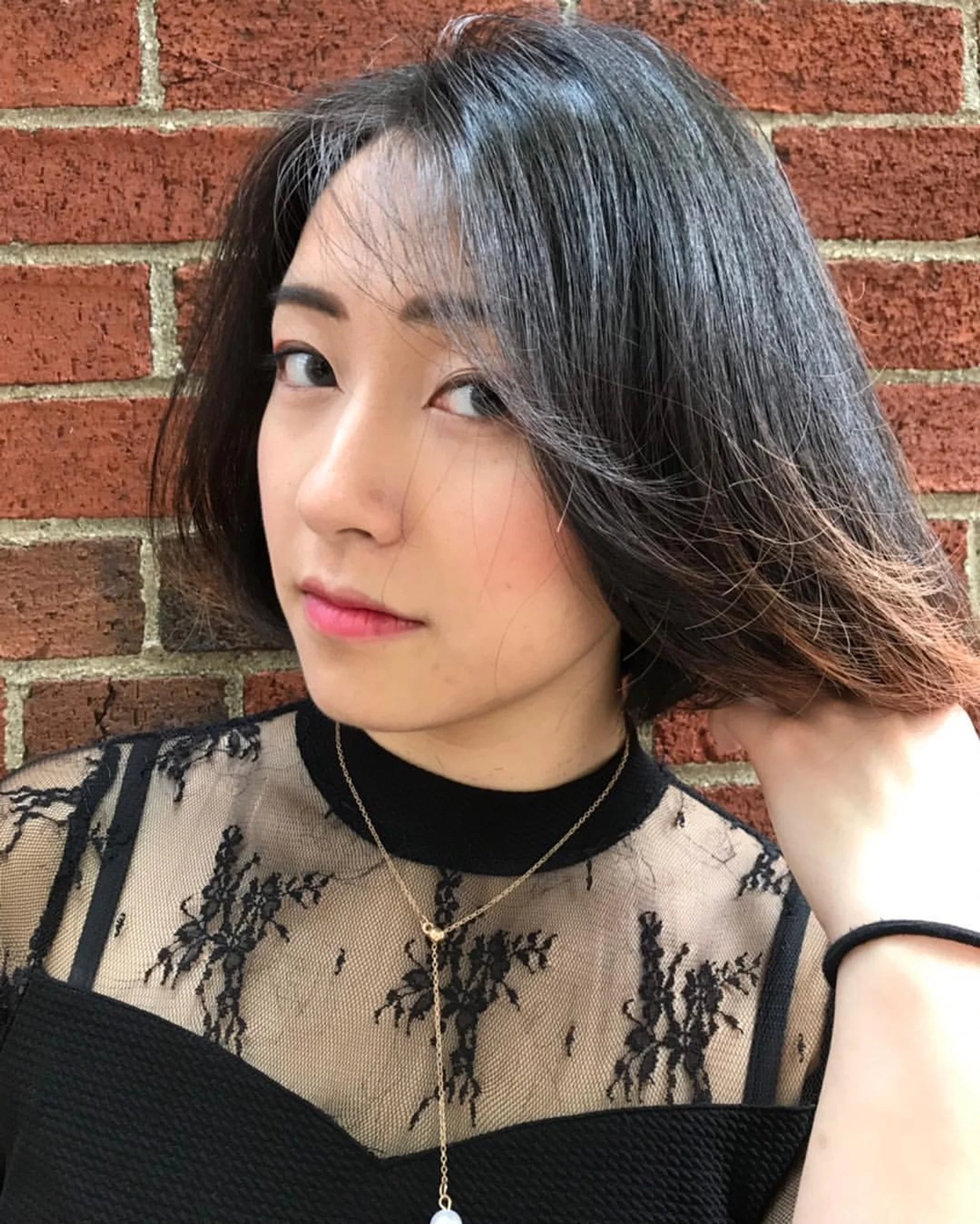 A woman confidently sporting a sleek Modern Asymmetrical Bob hairstyle. - Preview 2