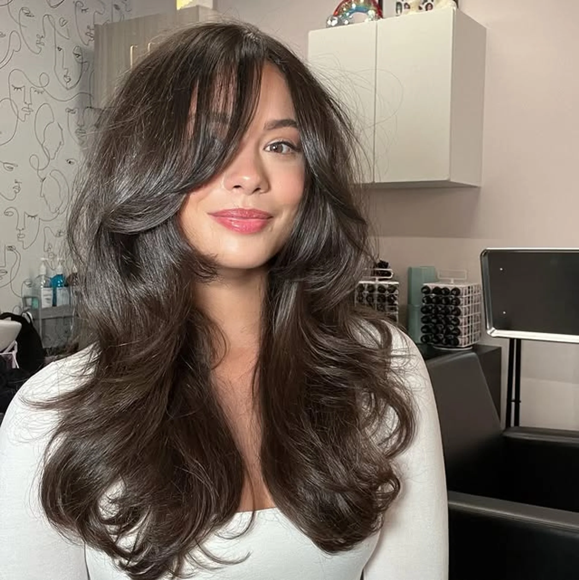 Glamorous woman with romantic red carpet waves, styled in a half-up fashion for a sophisticated look. - Preview 2