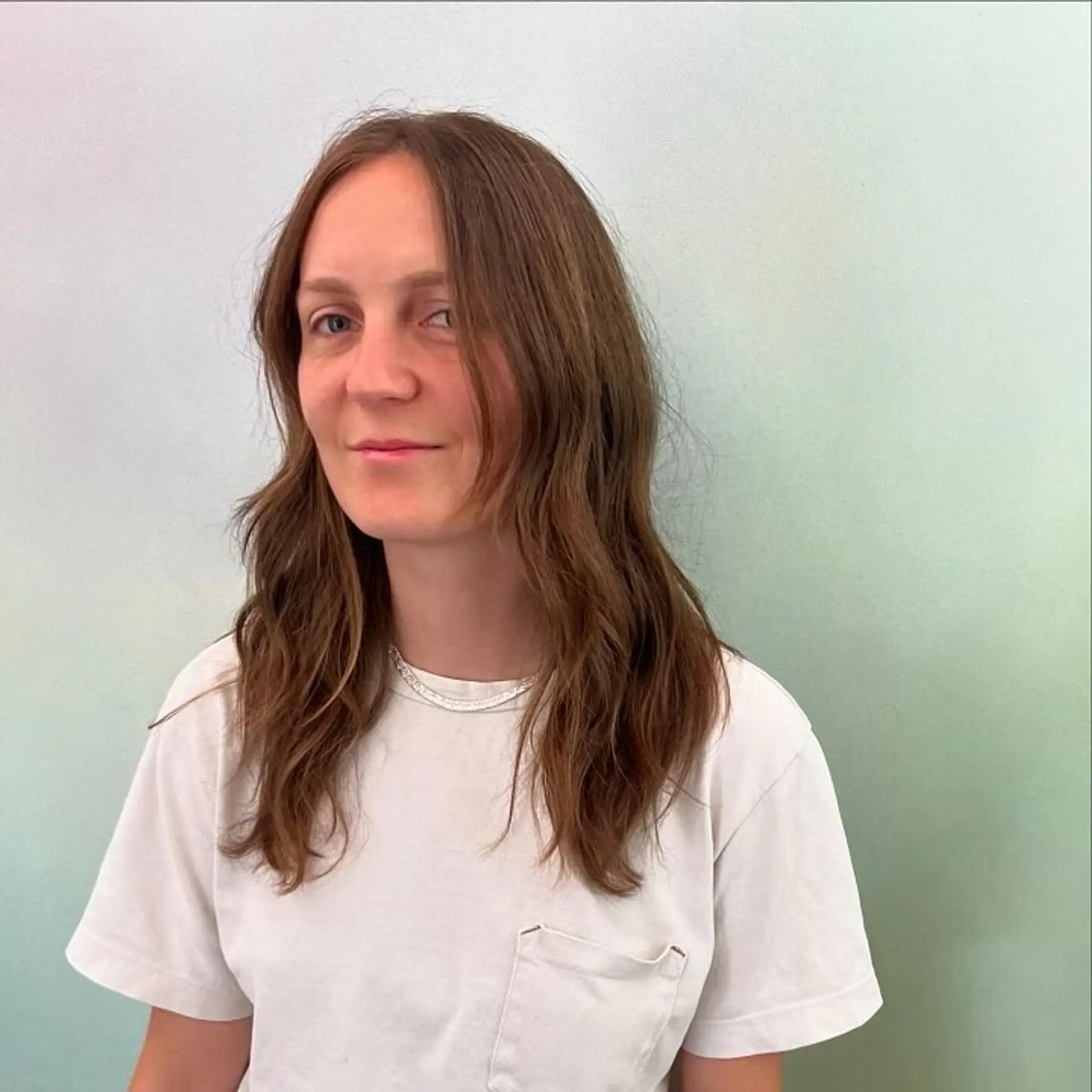 A medium-length textured cut with face-framing layers and soft, lived-in waves. 1