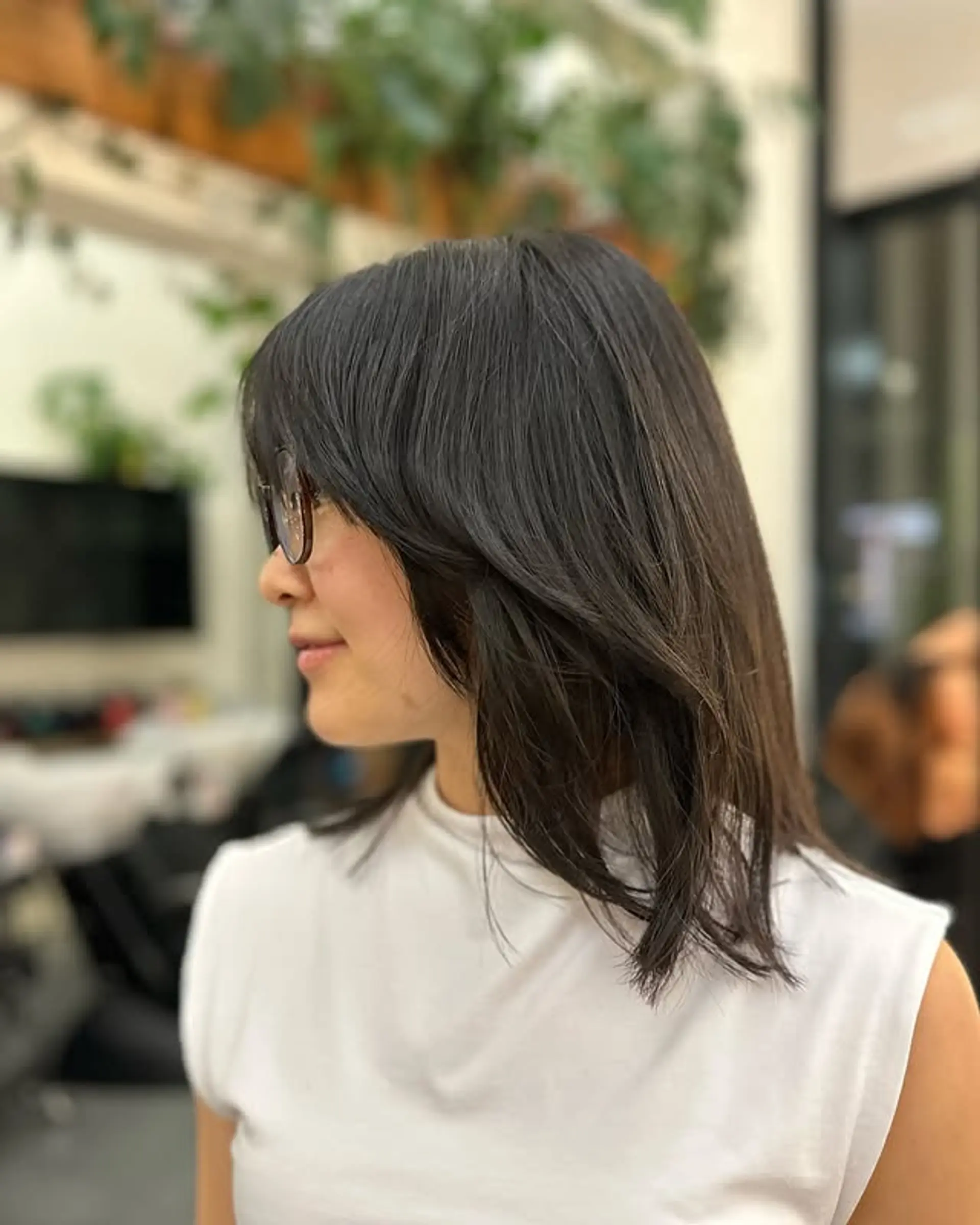 A chic medium-length bob with subtle layers and flattering face-framing. 1