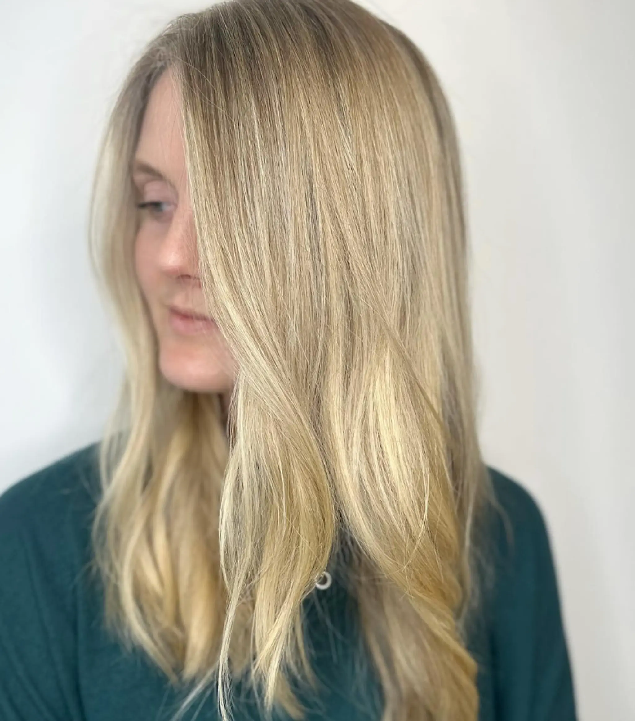 This long and wavy hairstyle features beautifully blended golden blonde hues with a side part and soft layers, creating a natural and sun-kissed appearance.

Color by @simabeautynyc 1