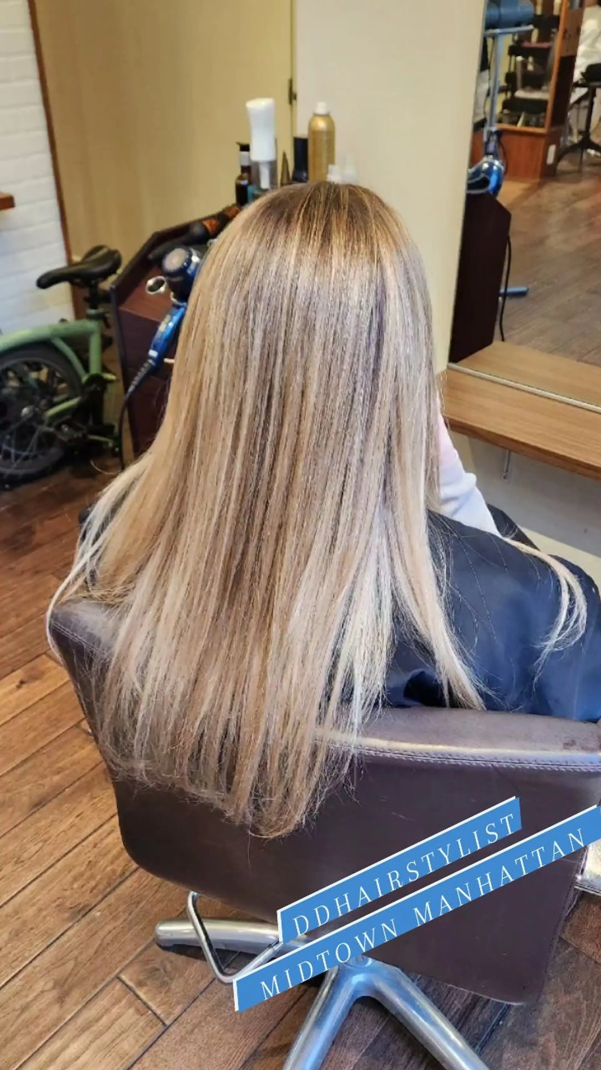 Long straight hair styled smoothly down the back, featuring fine blonde highlights blended over a natural light brown base. 1