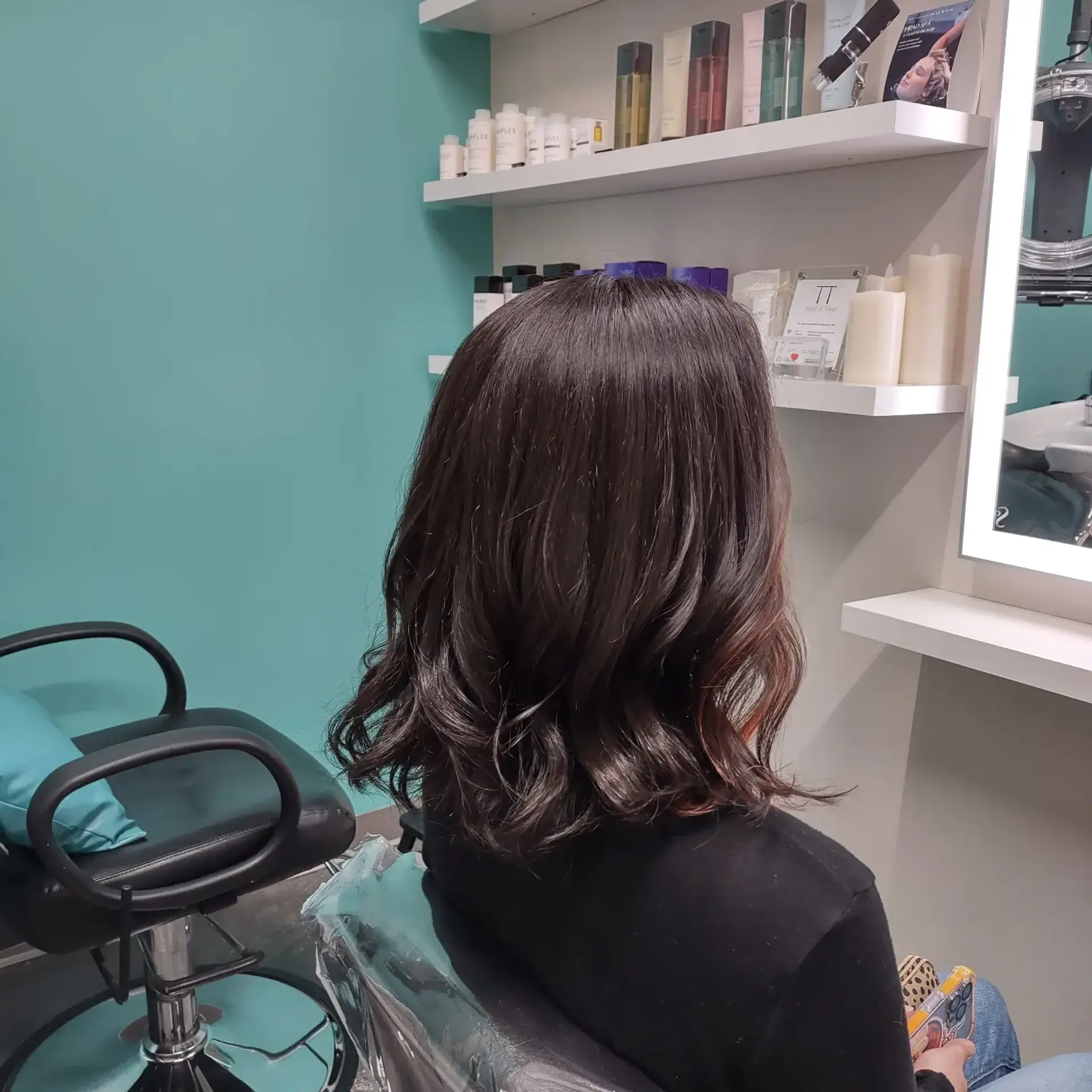 A textured shoulder-length lob styled with loose, relaxed waves and subtly flipped ends. 1