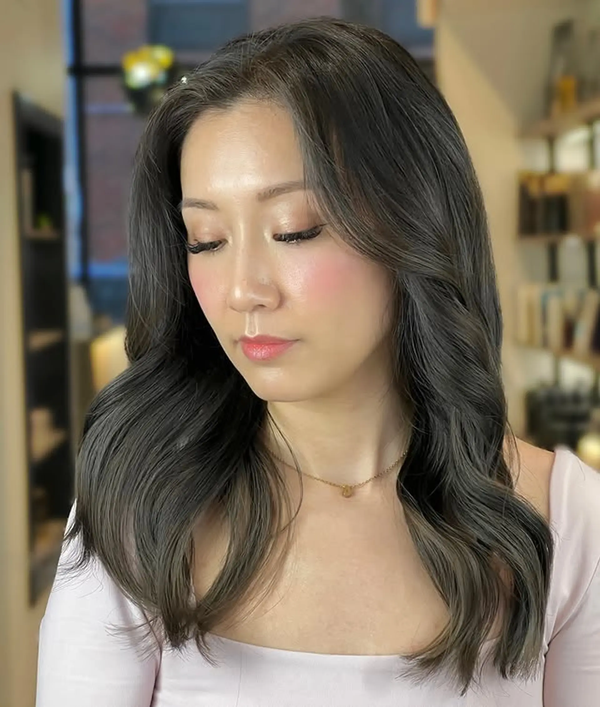 A trendy wavy lob with face-framing layers. 1