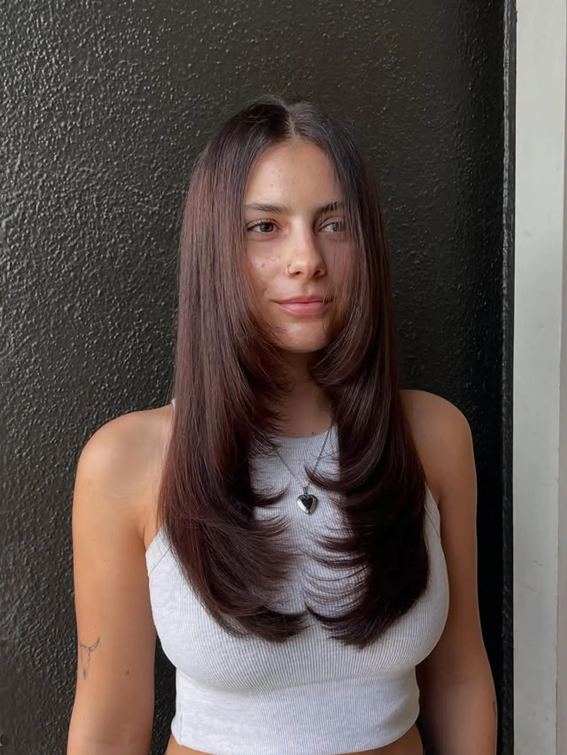 This long layered haircut features face-framing layers. 1