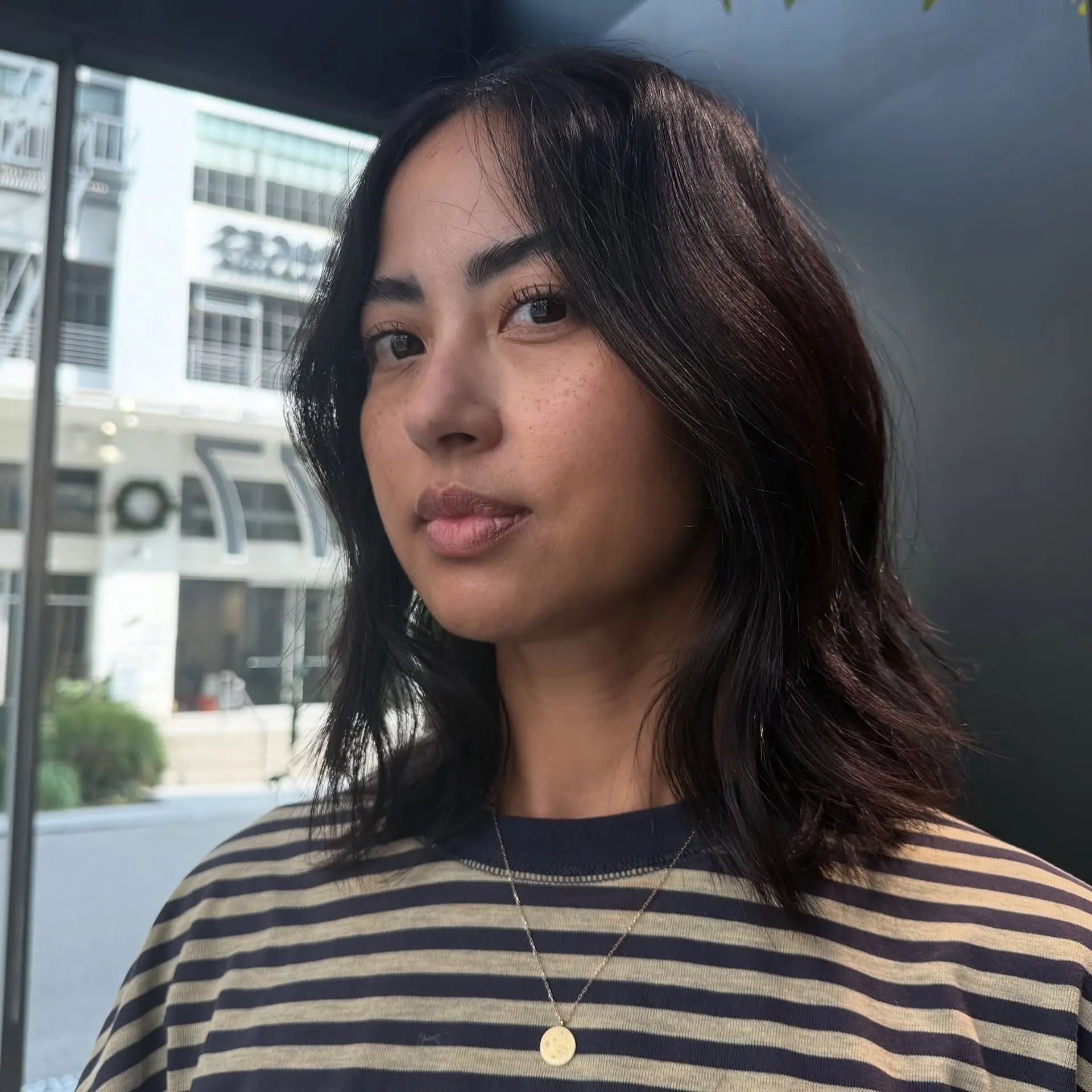 A textured, shoulder-length lob with soft face-framing layers and natural gentle waves. 1