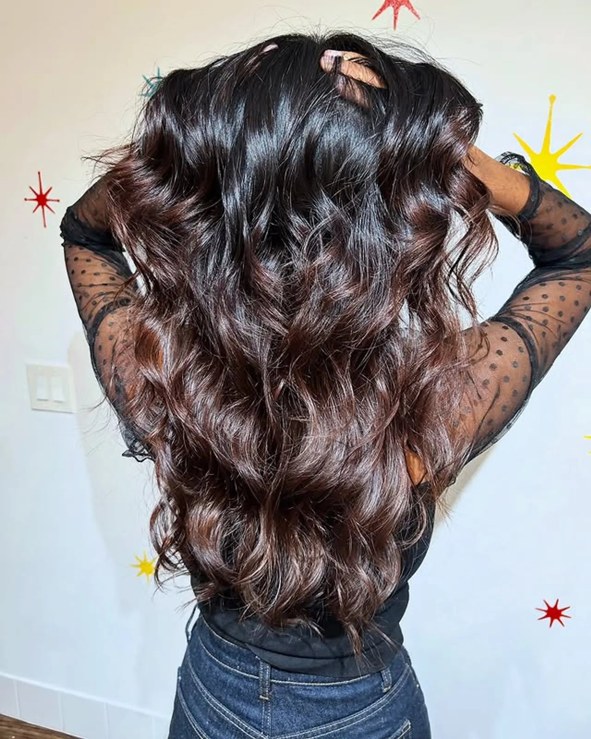 Long, wavy hairstyle with a dark to chocolate brown ombre. 1