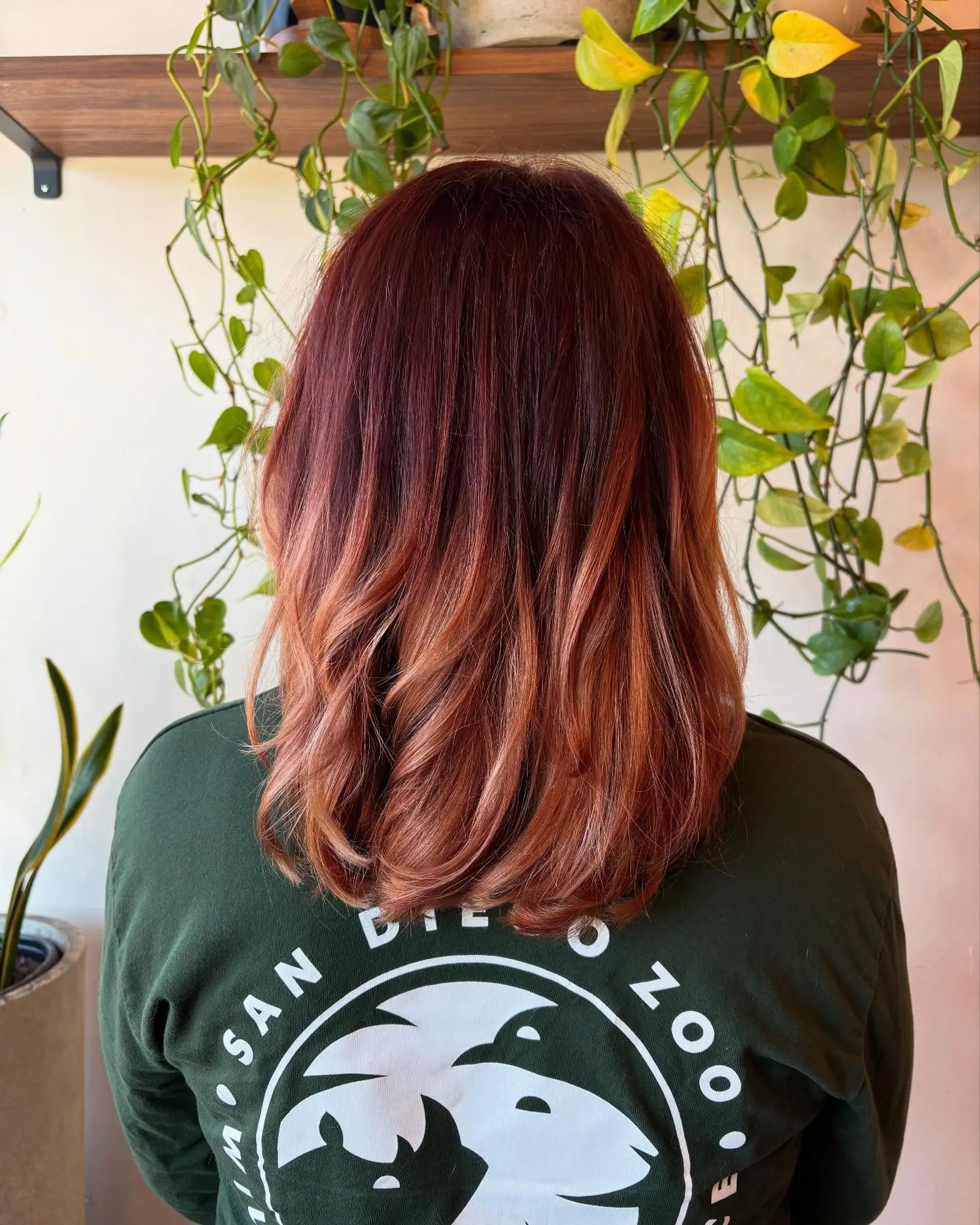 Medium-length layered hair featuring a rich copper base seamlessly transitioning into warm golden-copper ends. 1