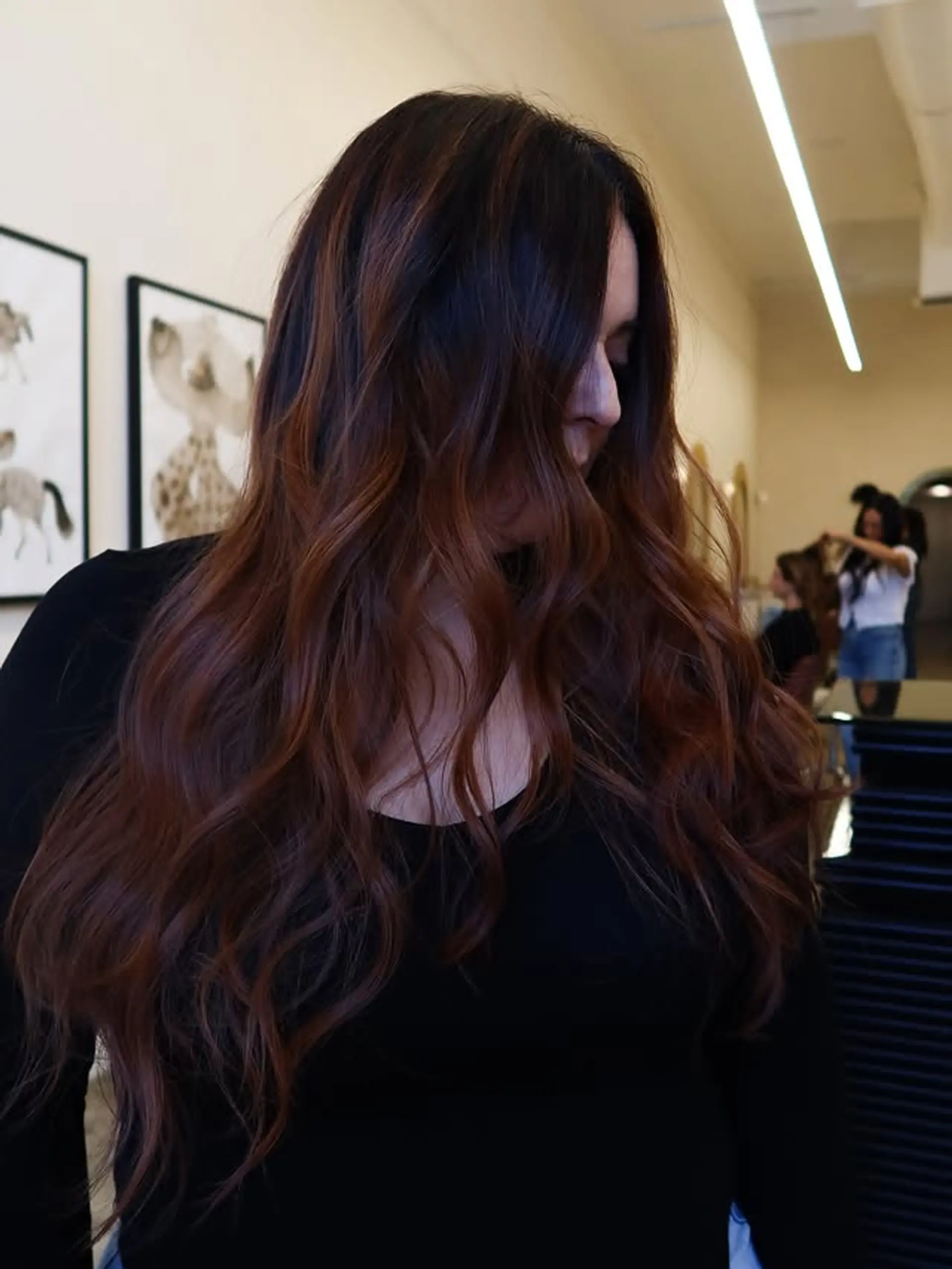 Long wavy hair with a blended balayage for a dimensional, low-maintenance look. 1