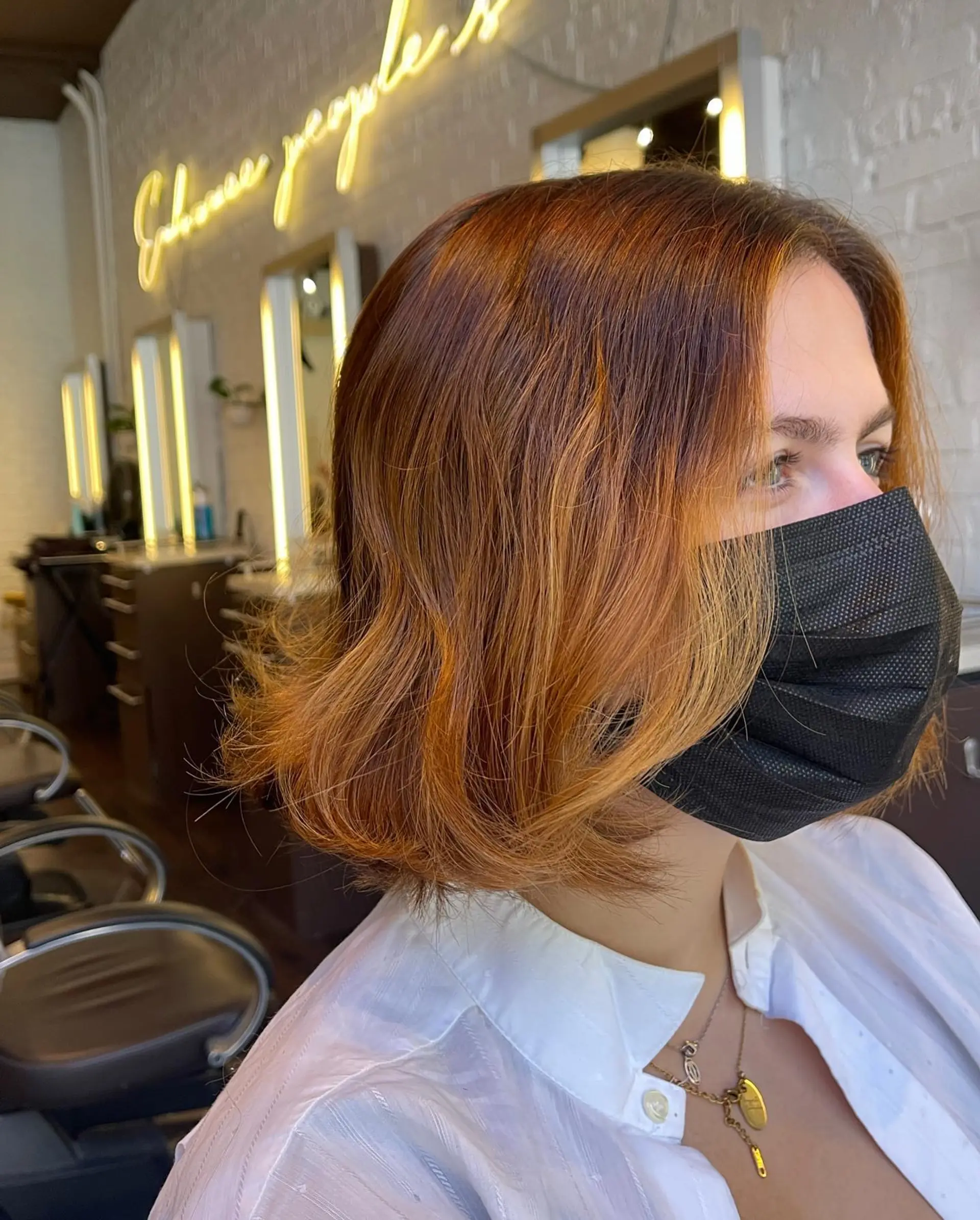 A chic, icy blonde layered bob cut to chin length. 2