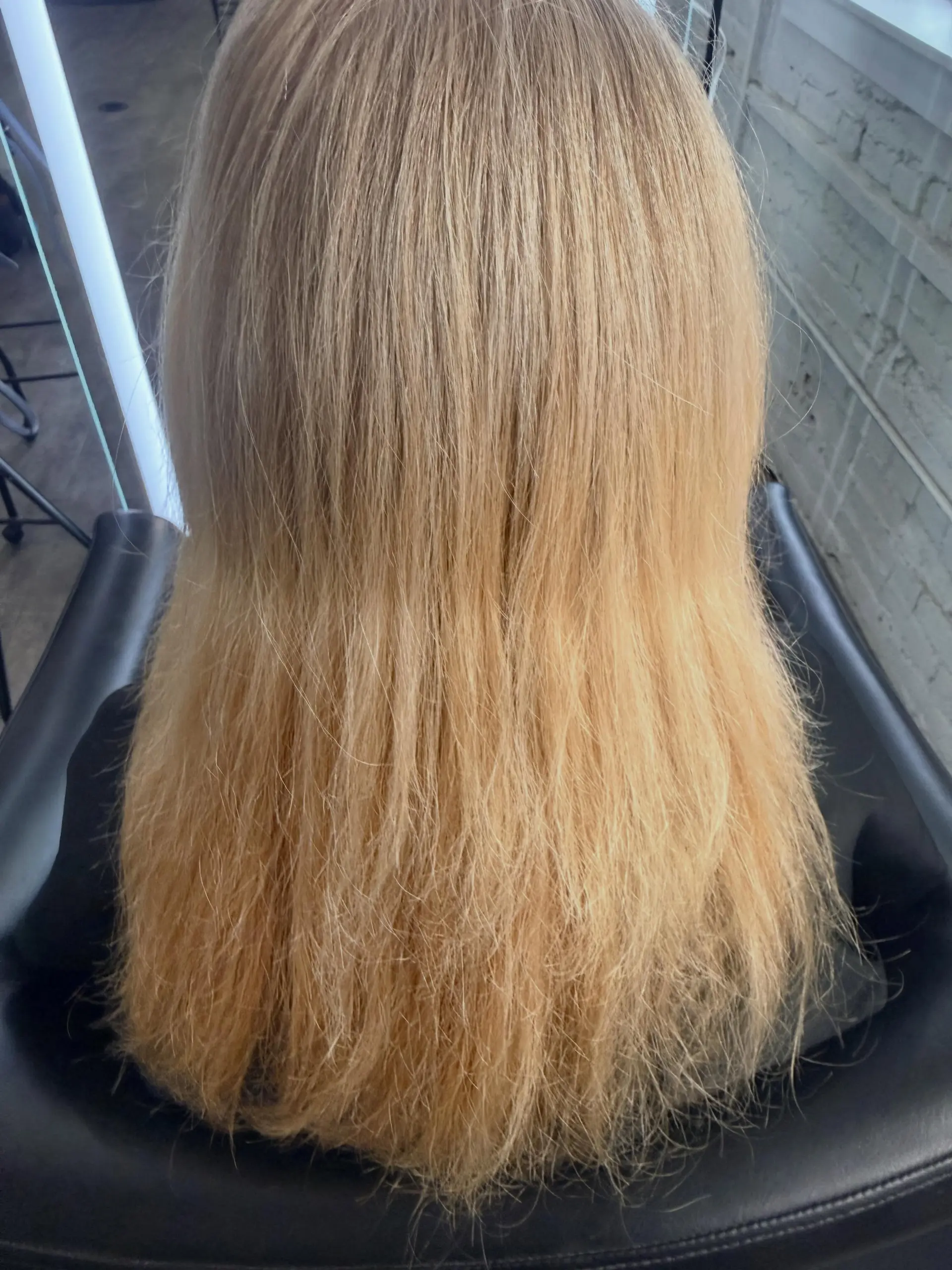 Medium-length straight hair colored in a soft, warm golden blonde shade. 1