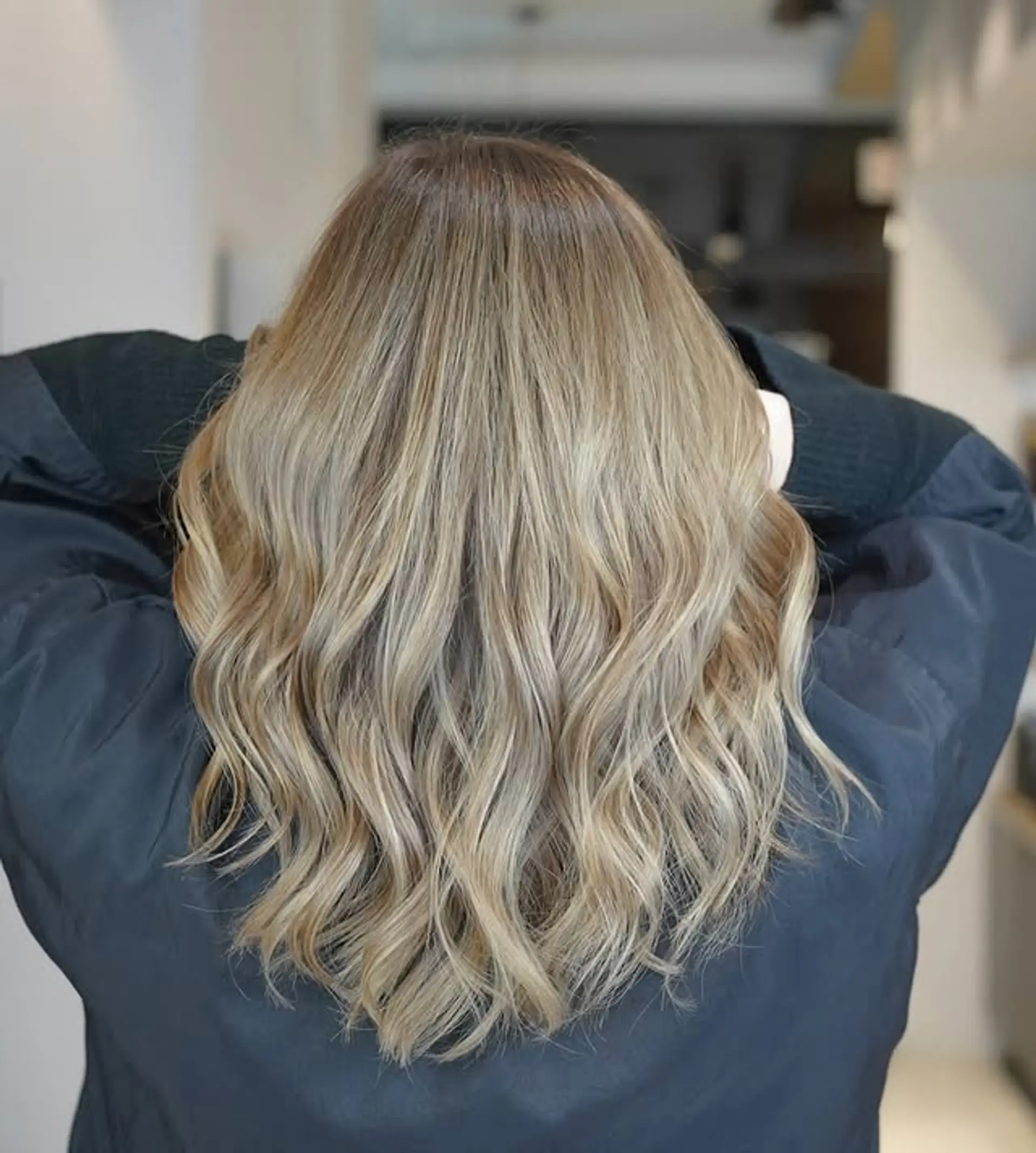 Long, wavy hairstyle with a honey blonde balayage. 1