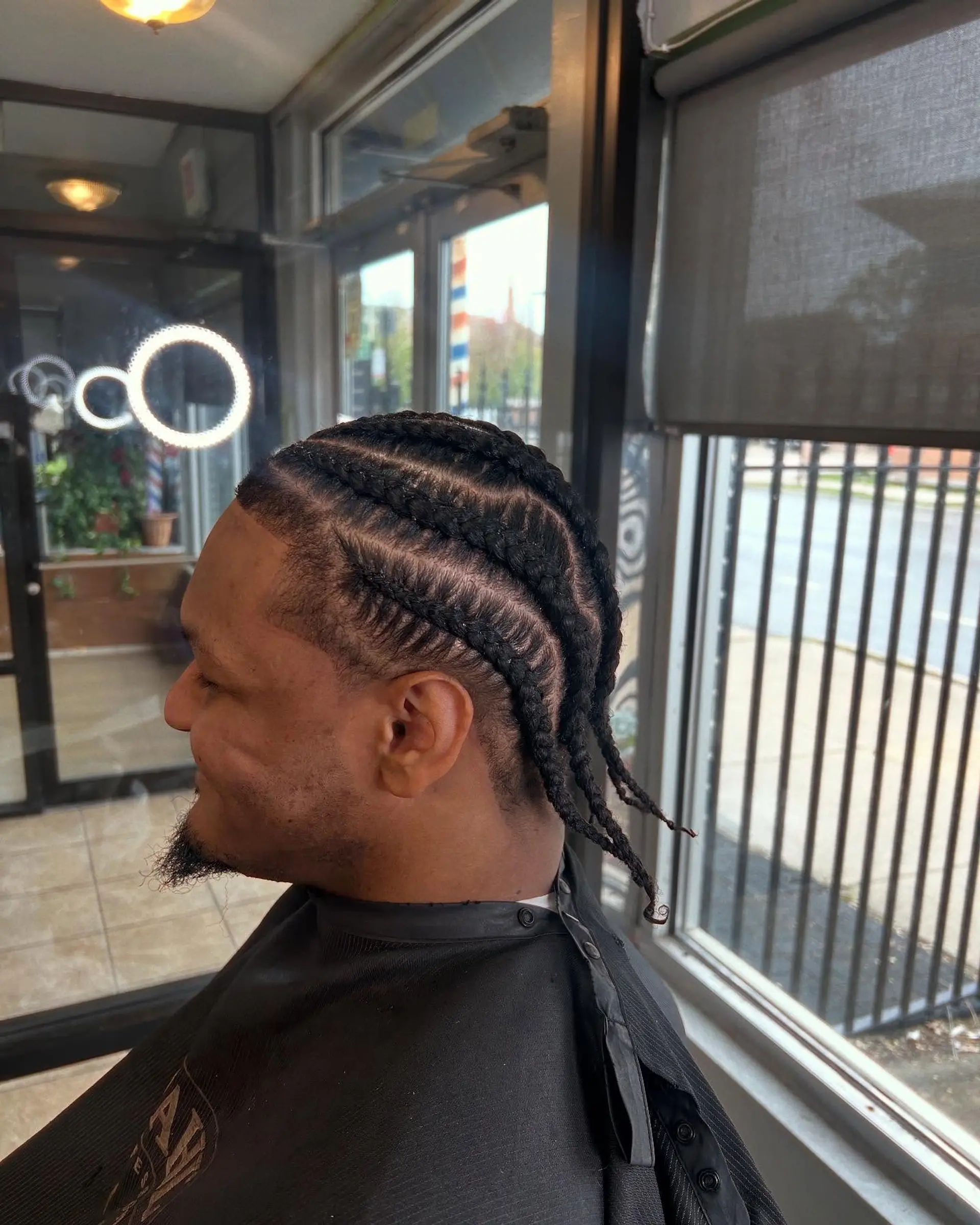 Short cornrow braids with a taper fade. 1