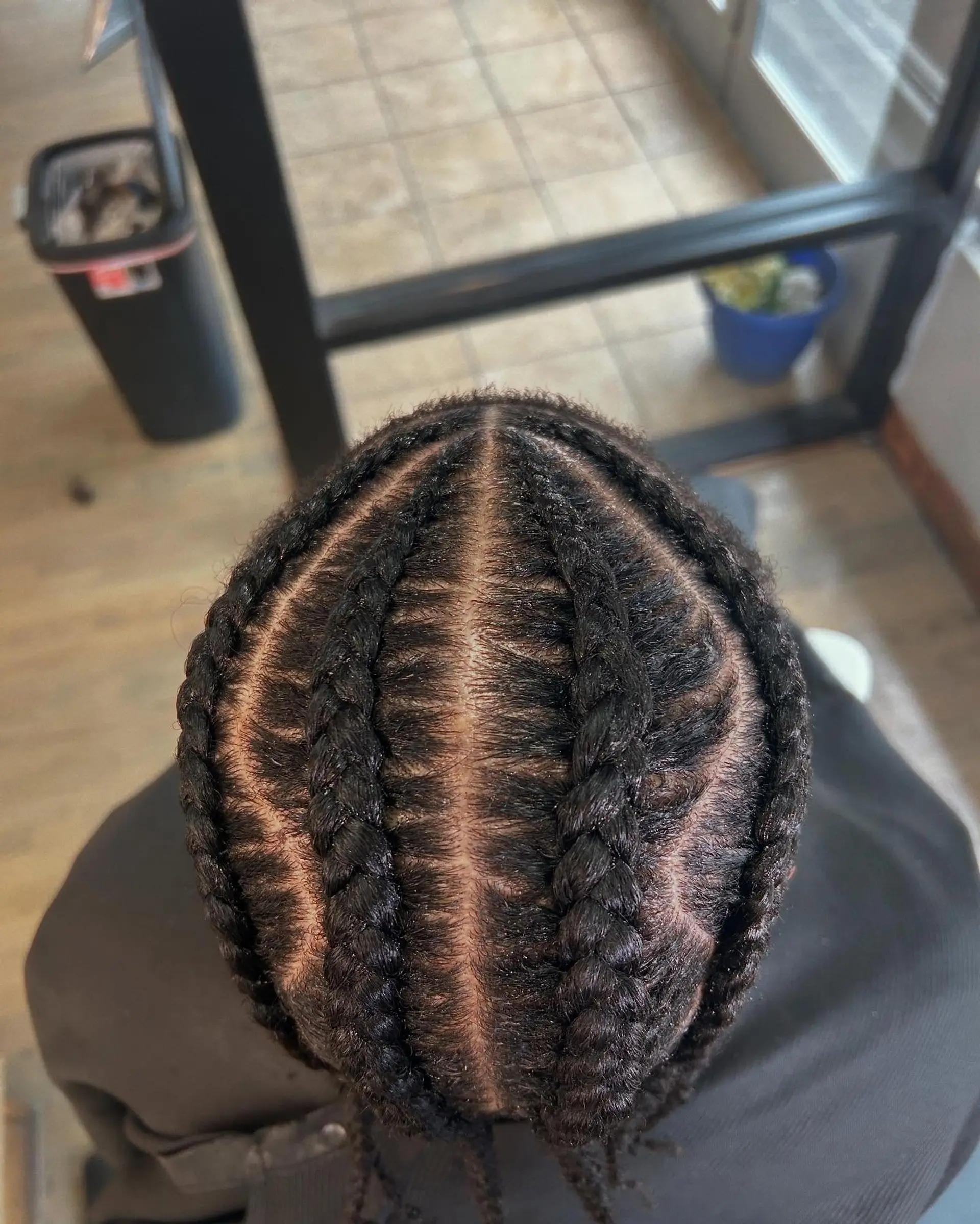 Short cornrow braids with a taper fade. 3