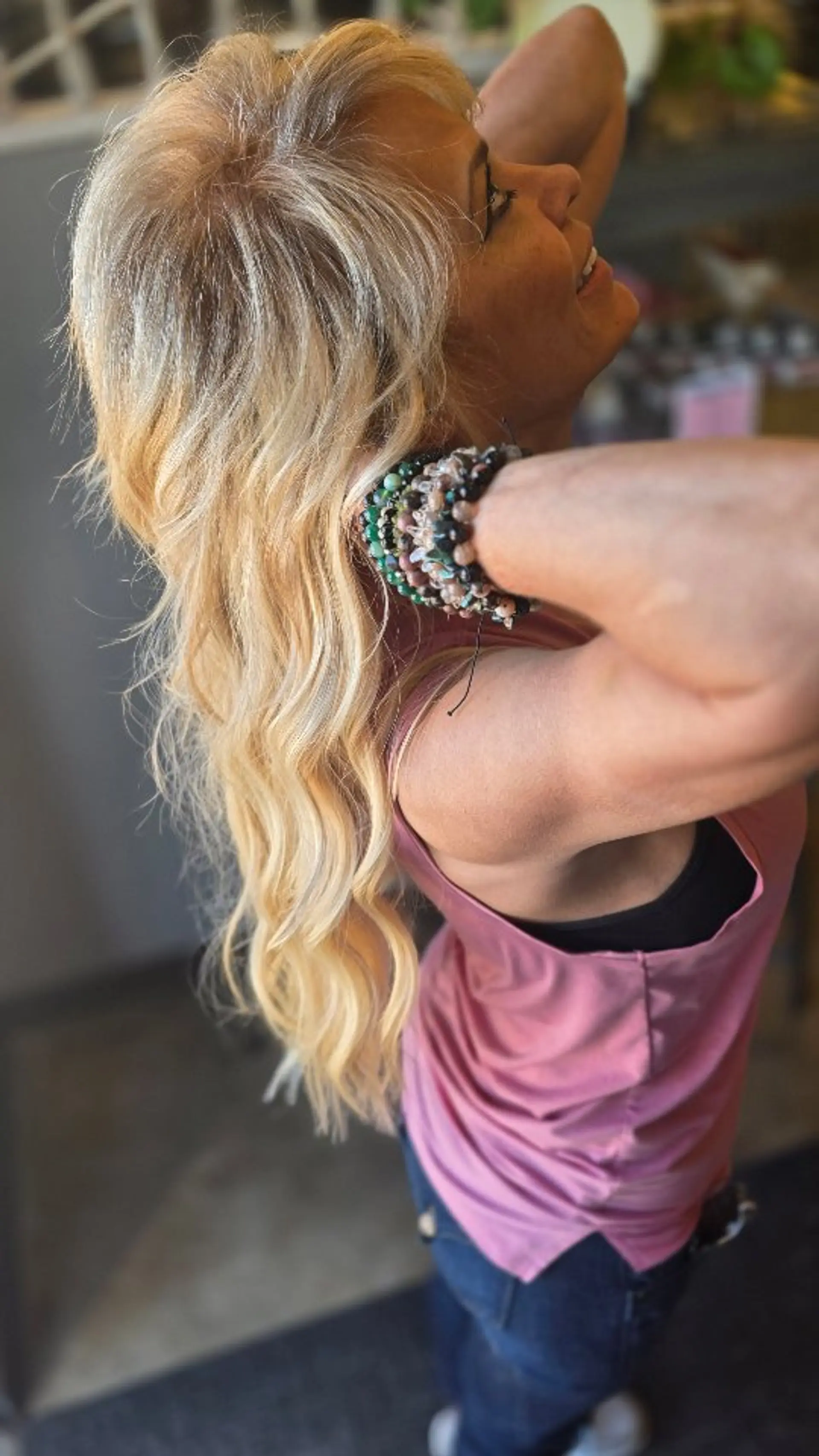 Long, multi-tonal blonde hair styled in effortless, cascading waves. 1
