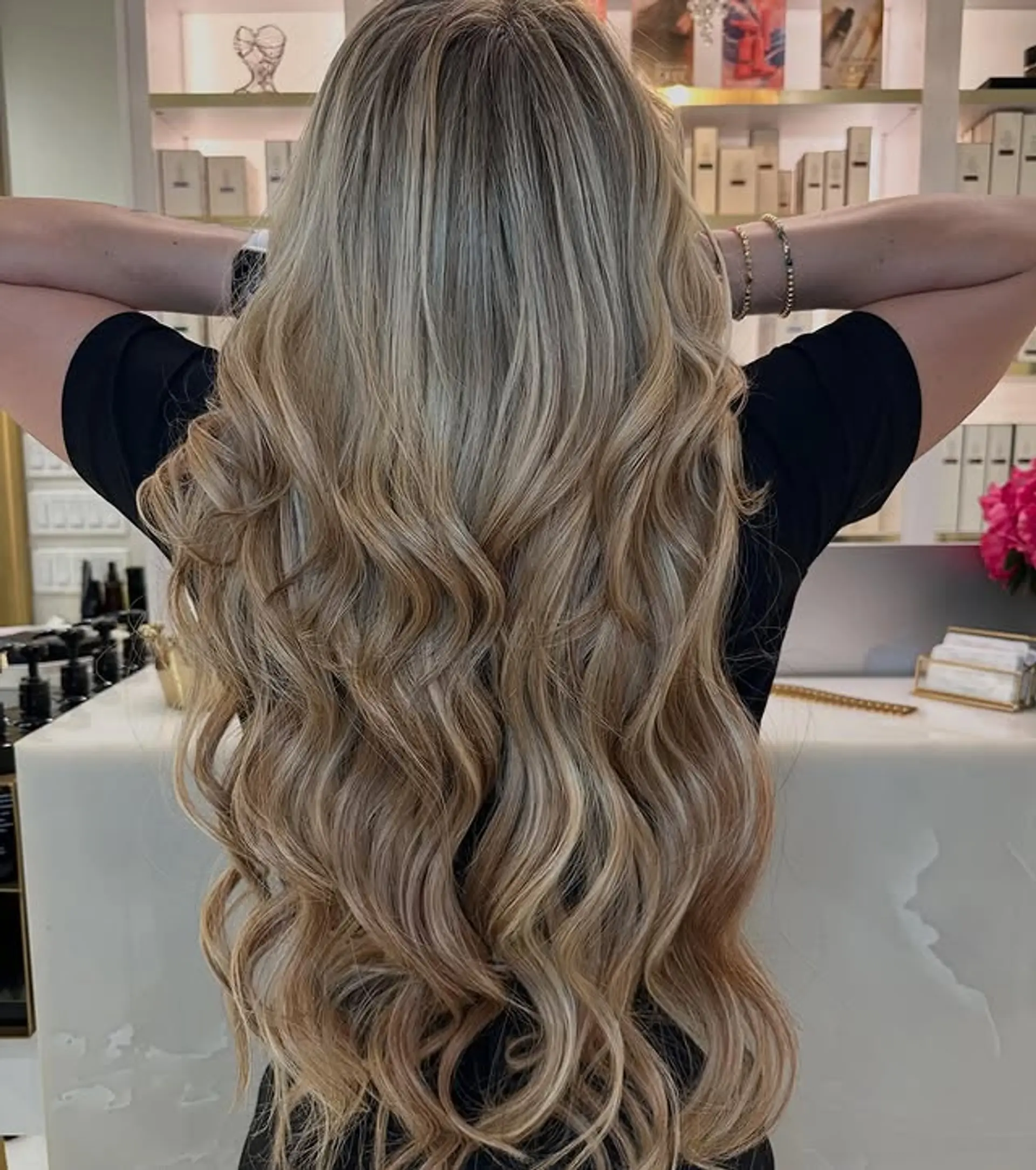 Long, flowing waves with a golden and ash blonde balayage. 1