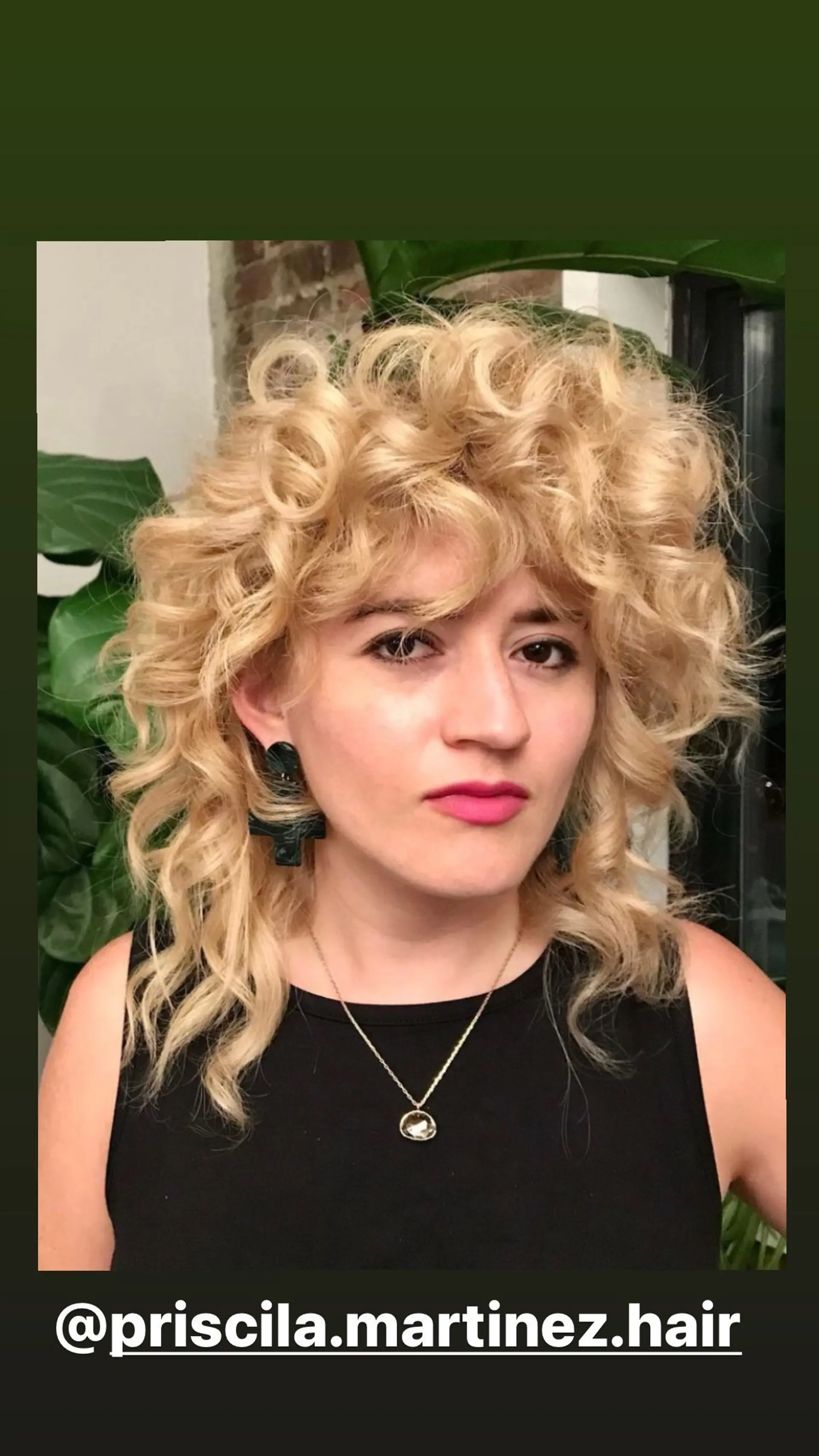 A curly shag haircut with curtain bangs that frame the face. 1