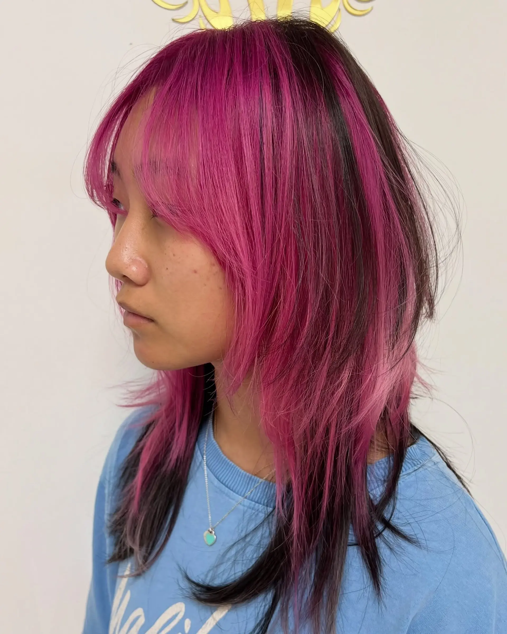 A choppy, medium-length mullet with face-framing fringe and bold hot pink chunky highlights. 1