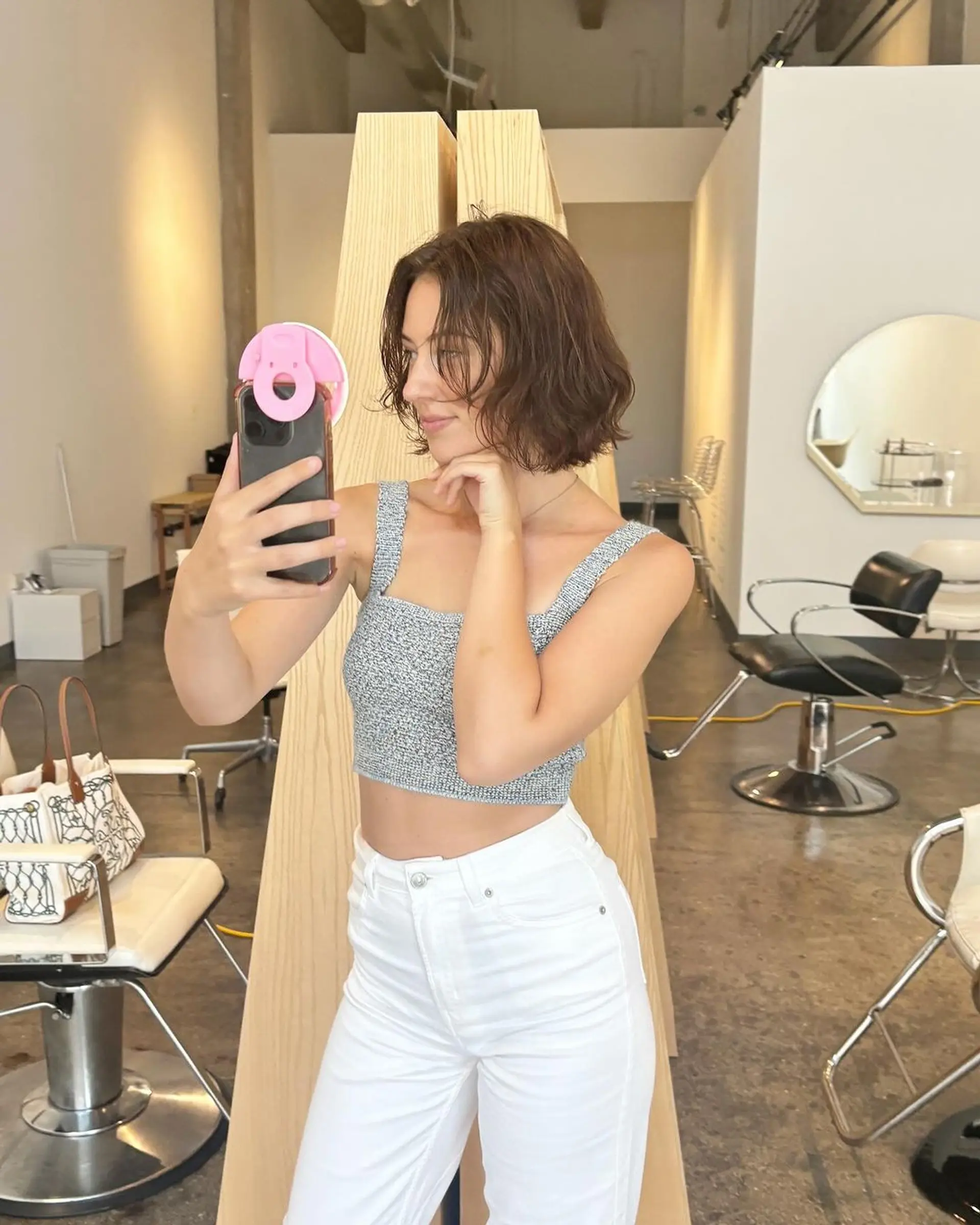 Short, wavy bob cut with a tousled, casual style and medium brown color. 3