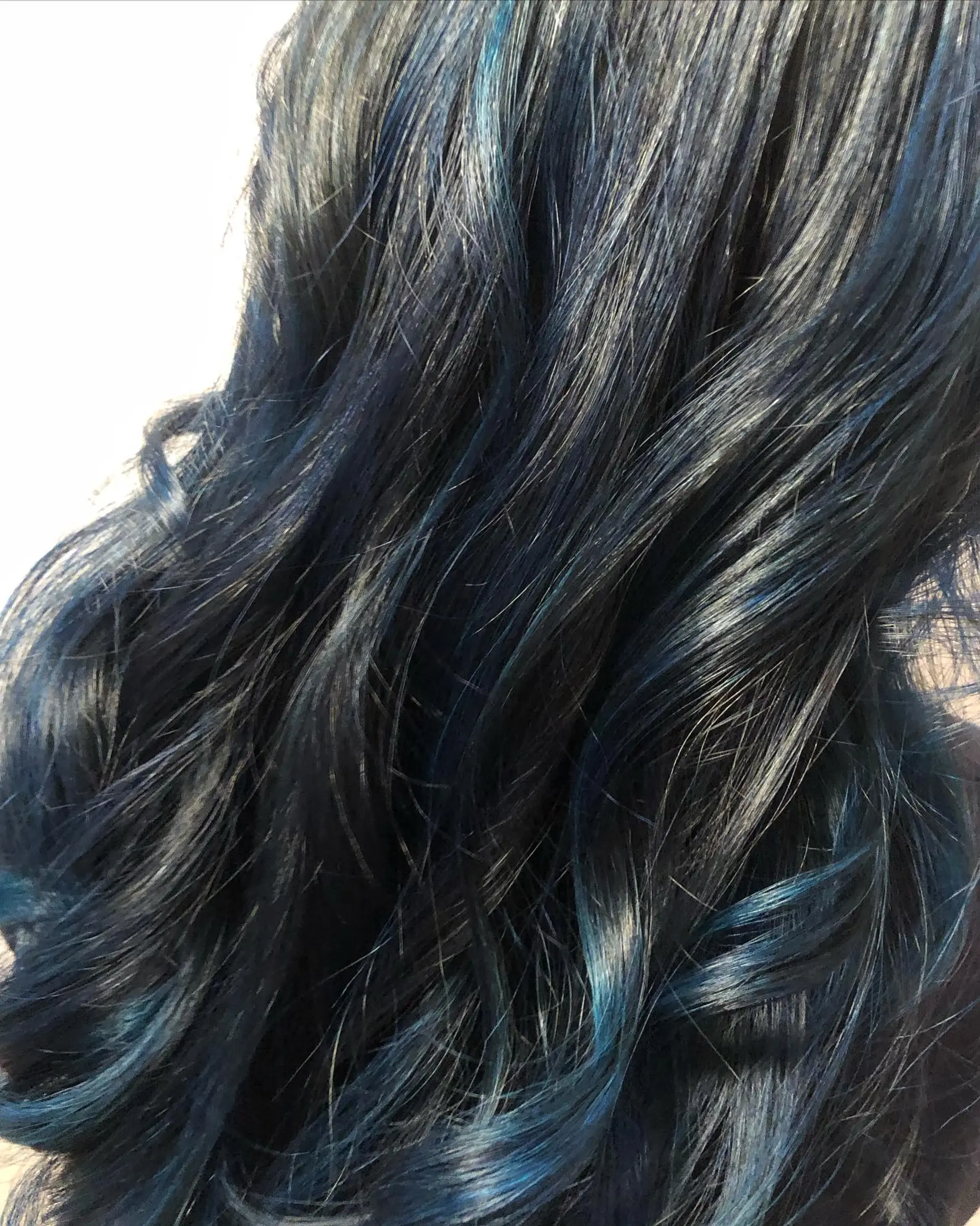 Deep midnight blue and dark navy tones blended through long, loose waves. 1