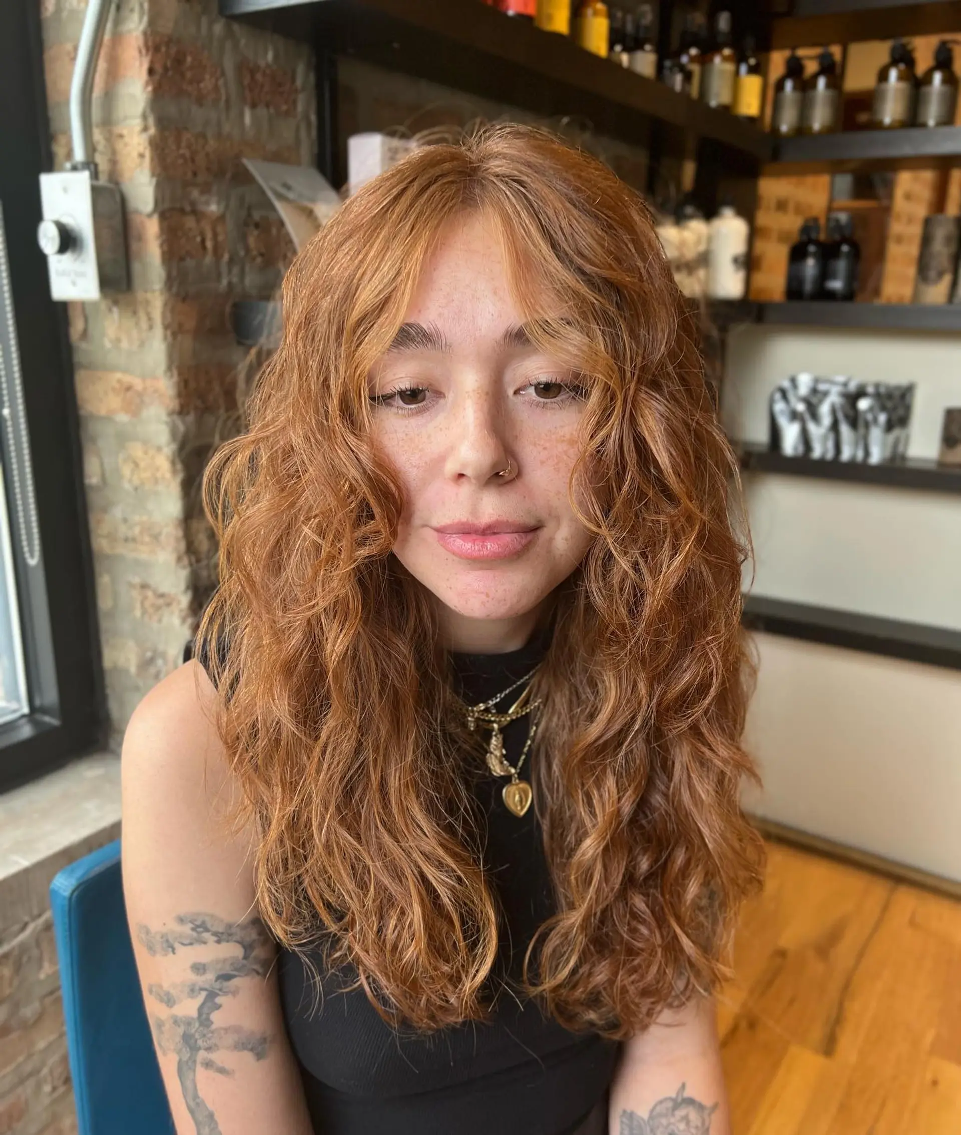 A long, wavy shag with soft layers and face-framing curtain bangs. 1