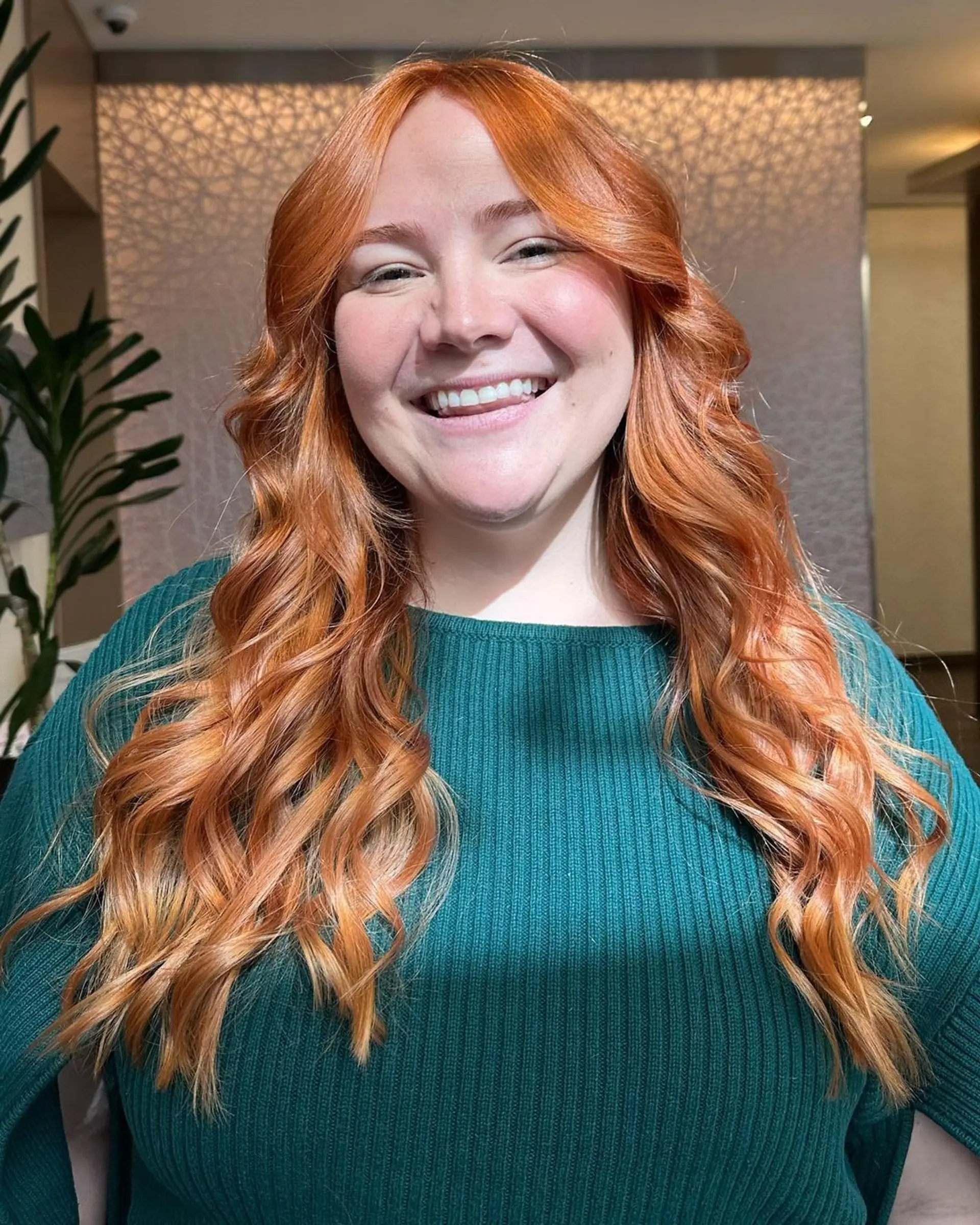 Very long, copper-colored hair with voluminous waves and loose curls, featuring layered cuts and golden highlights for added dimension.

Color by @simabeautynyc
Cut and style by @juliamannino_hair
 2