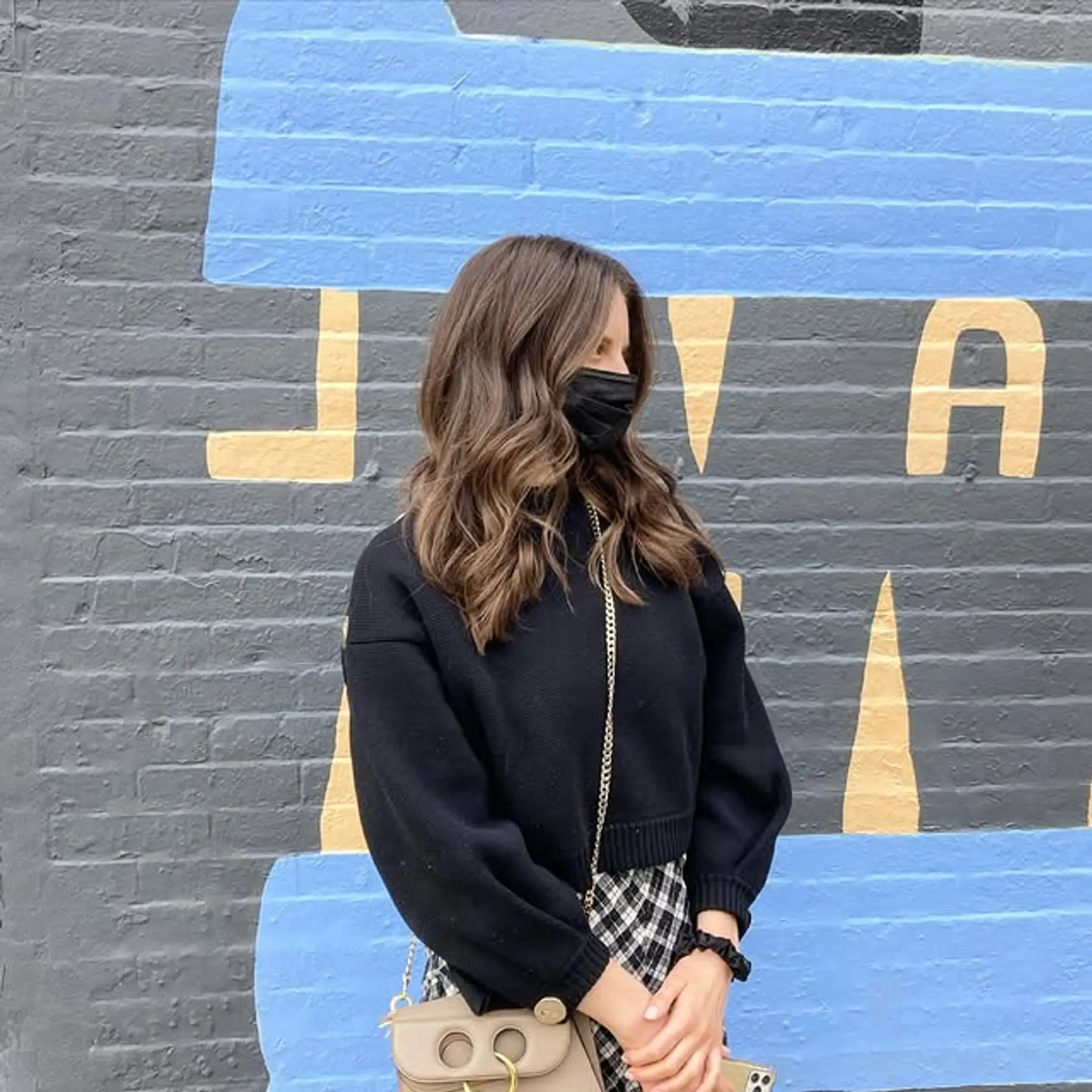 A trendy shoulder-length hairstyle with soft waves and a warm, bronzed brown color. 1