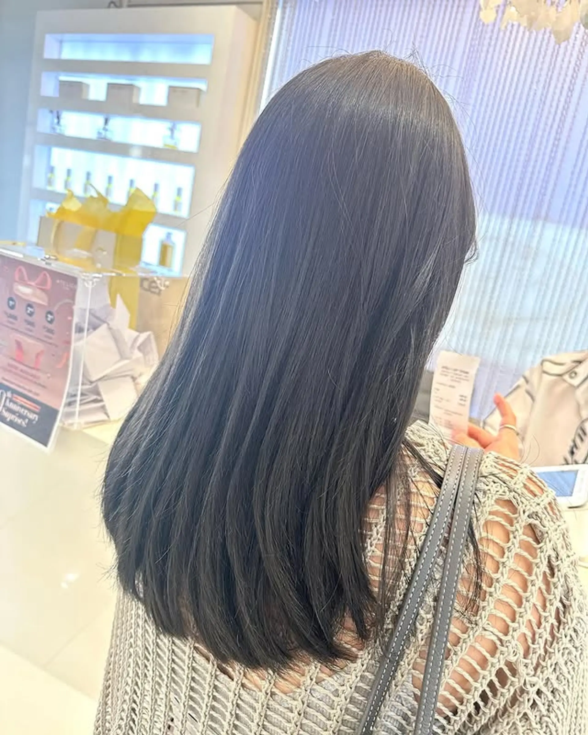 Long straight hair with subtle layers and modern ash brown coloring. 1