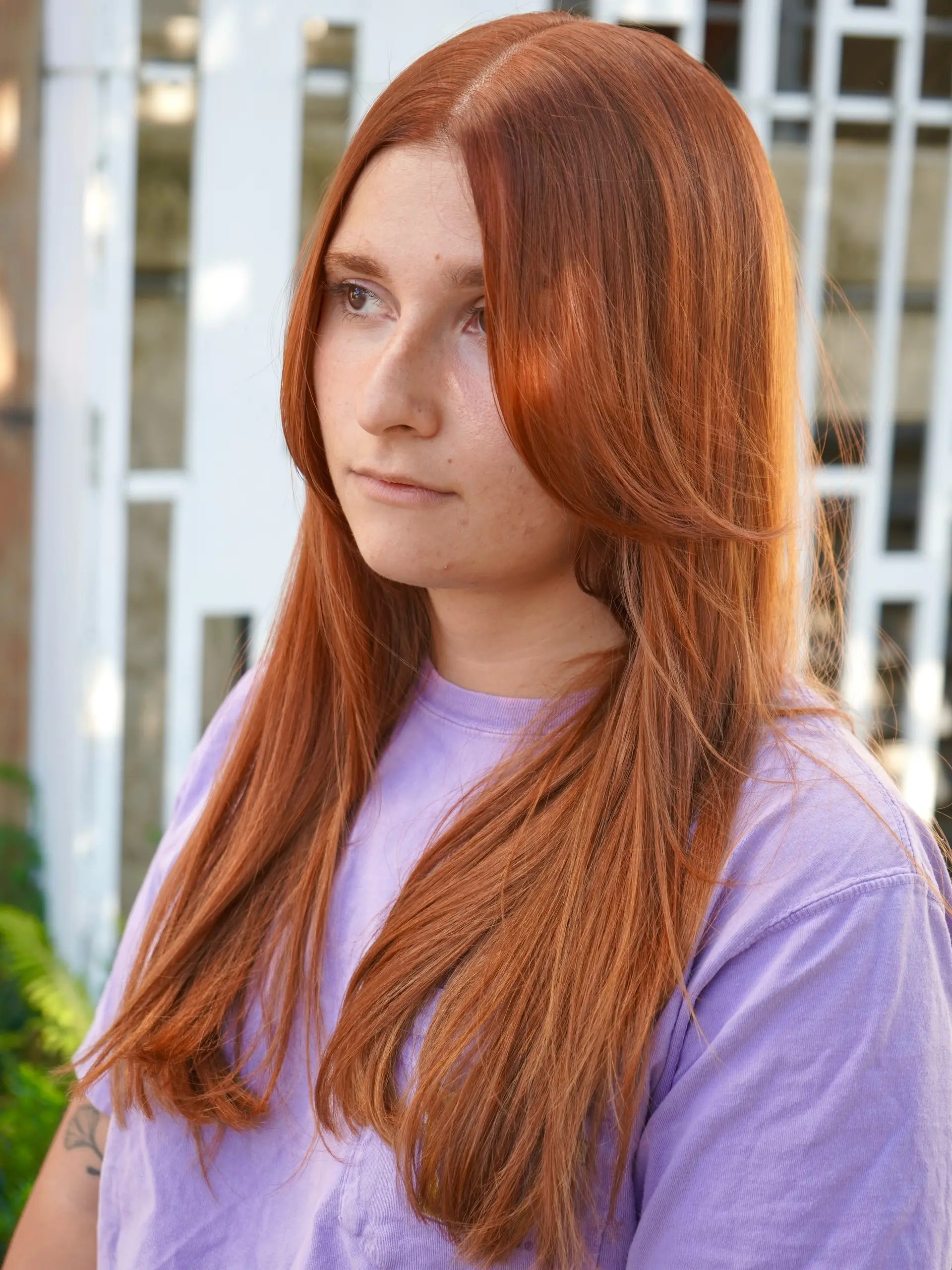 Vibrant copper red long hair with a center part and soft face-framing layers. 1