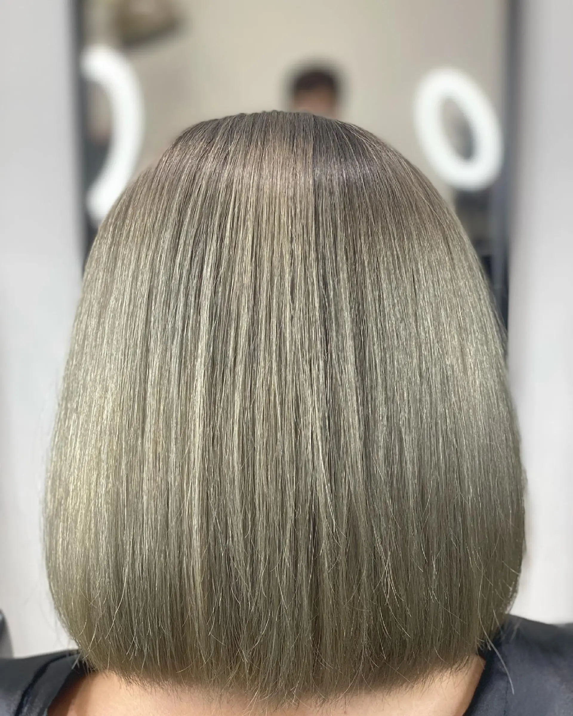 A sleek, straight, medium-length bob with a blunt cut. 1
