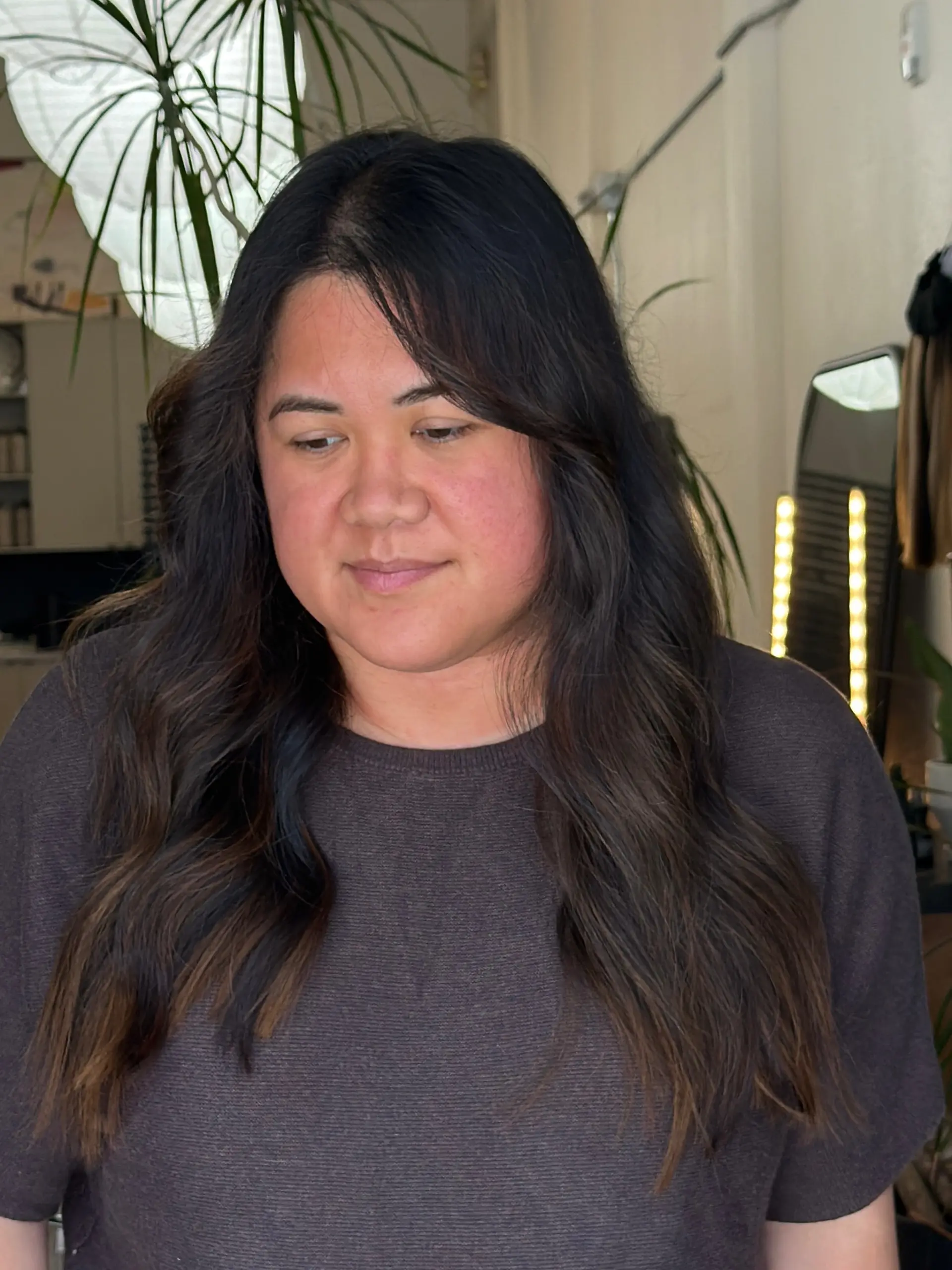 Long, flowing espresso brown hair styled with gentle waves and textured ends. 1