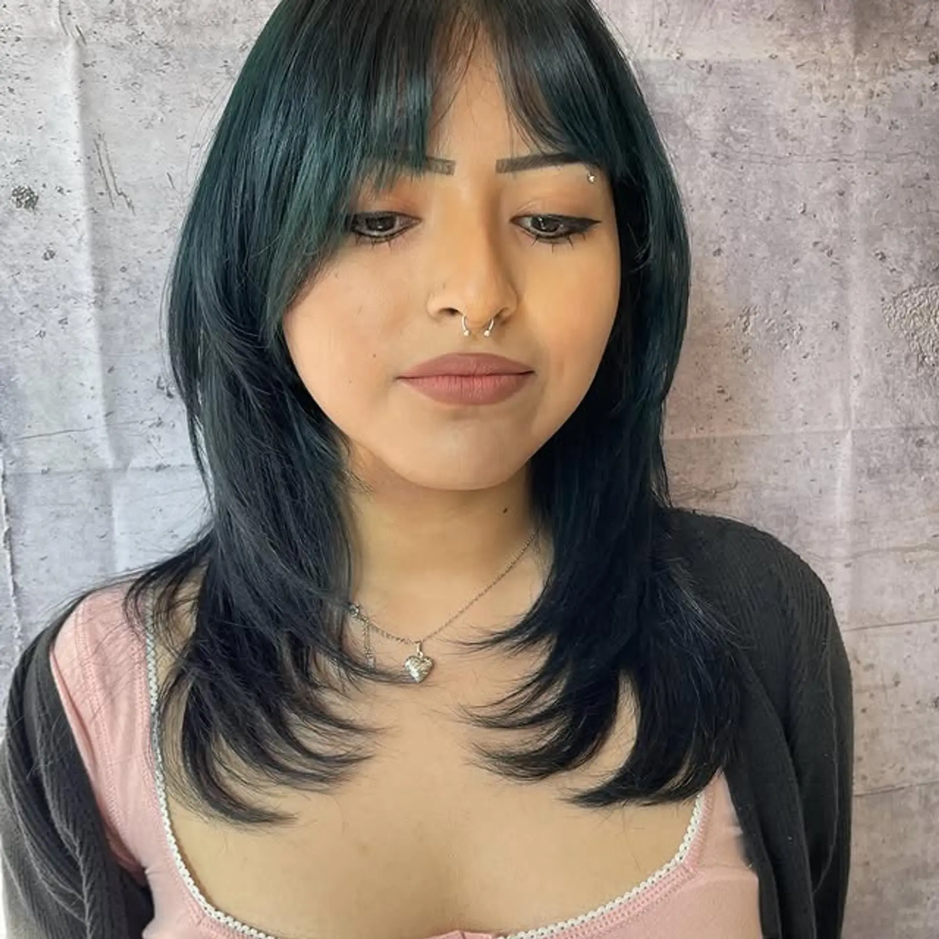 A medium-length shag with face-framing layers and trendy baby bangs. 1