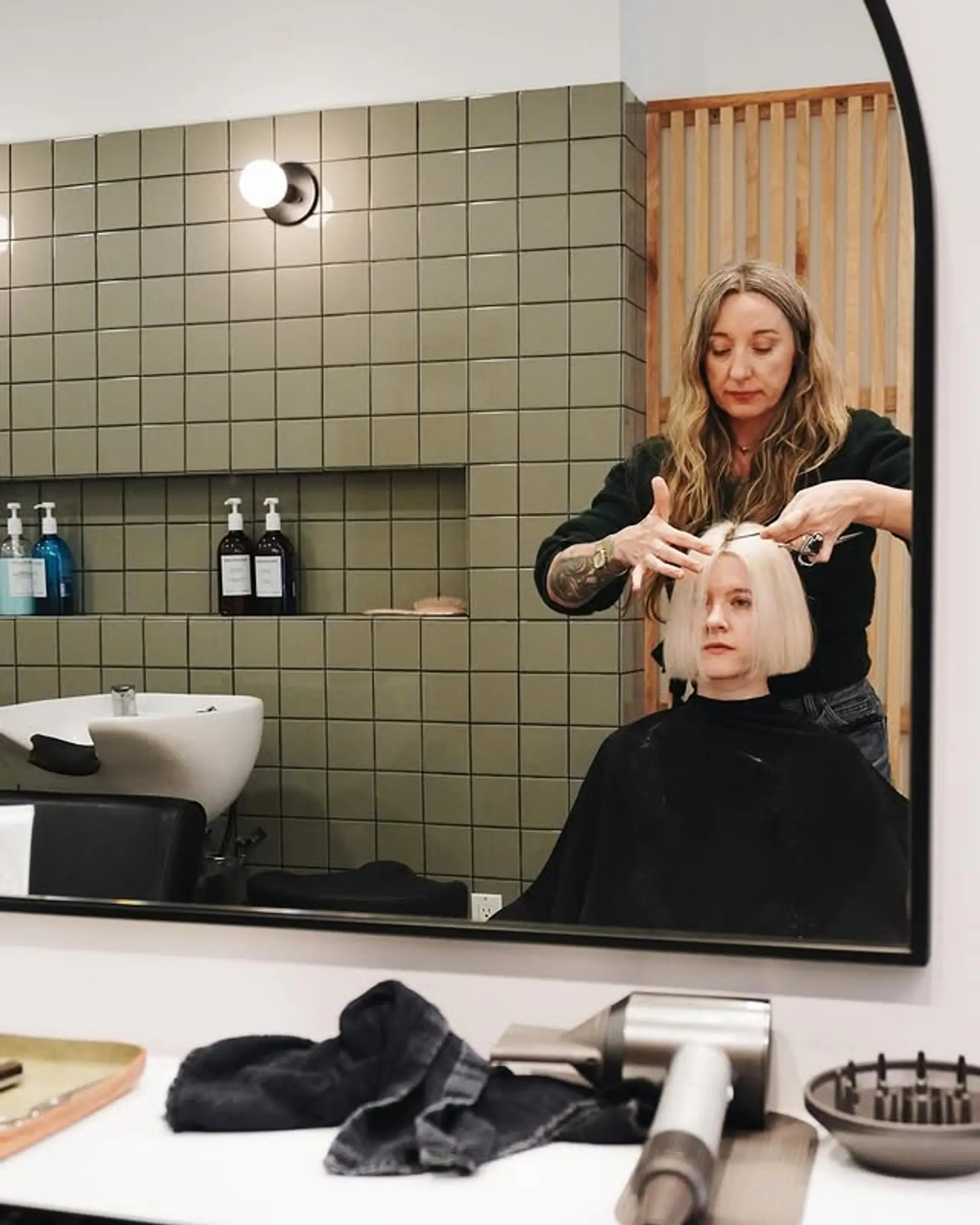 A short, straight blunt bob with bangs. 1