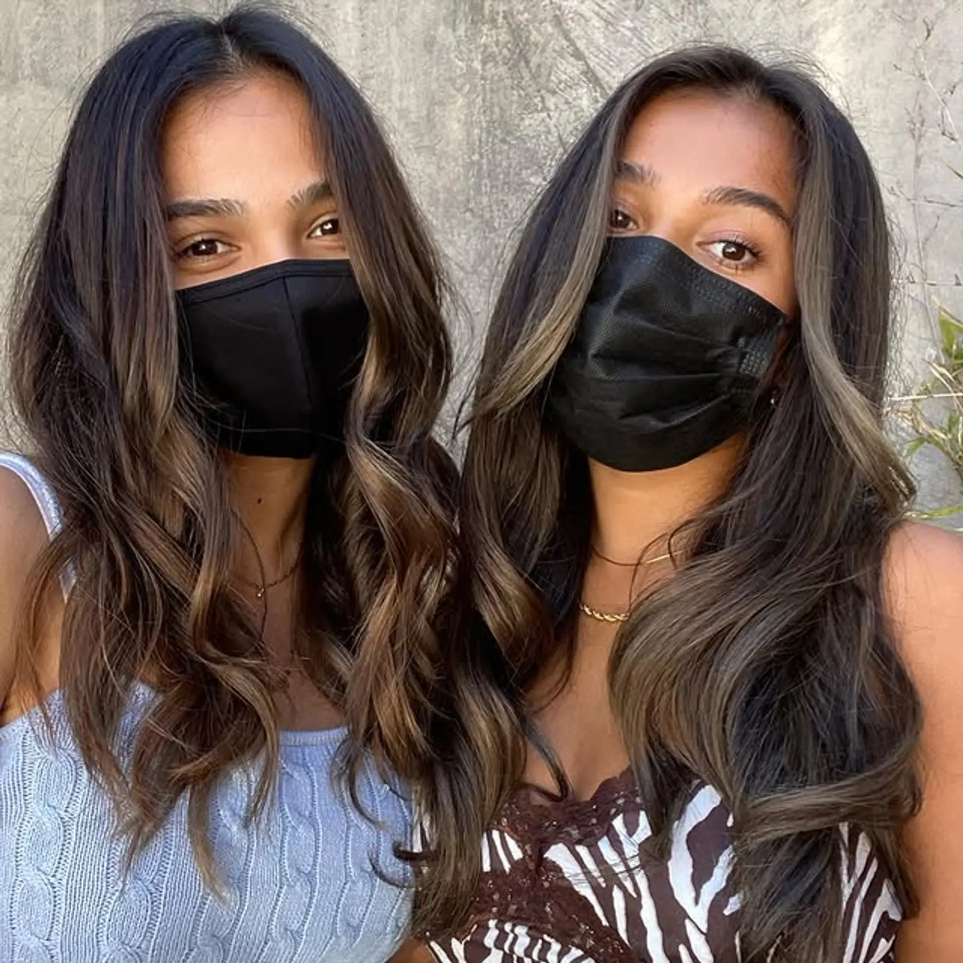 Long, wavy brunette hair with a subtle blonde balayage. 1