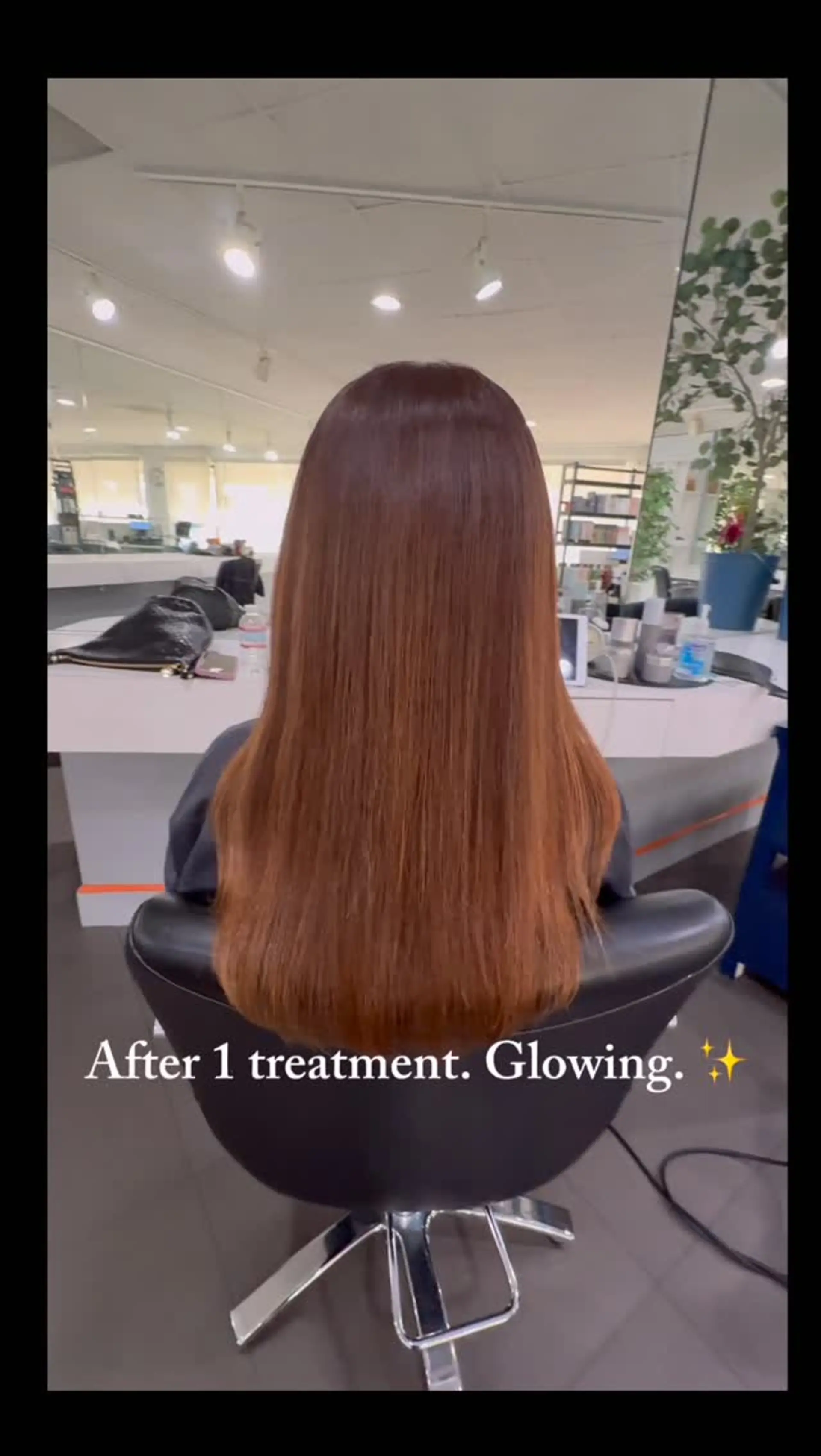 Sleek and straight long hair styled with exceptional shine and smoothness in a rich warm auburn shade. 1