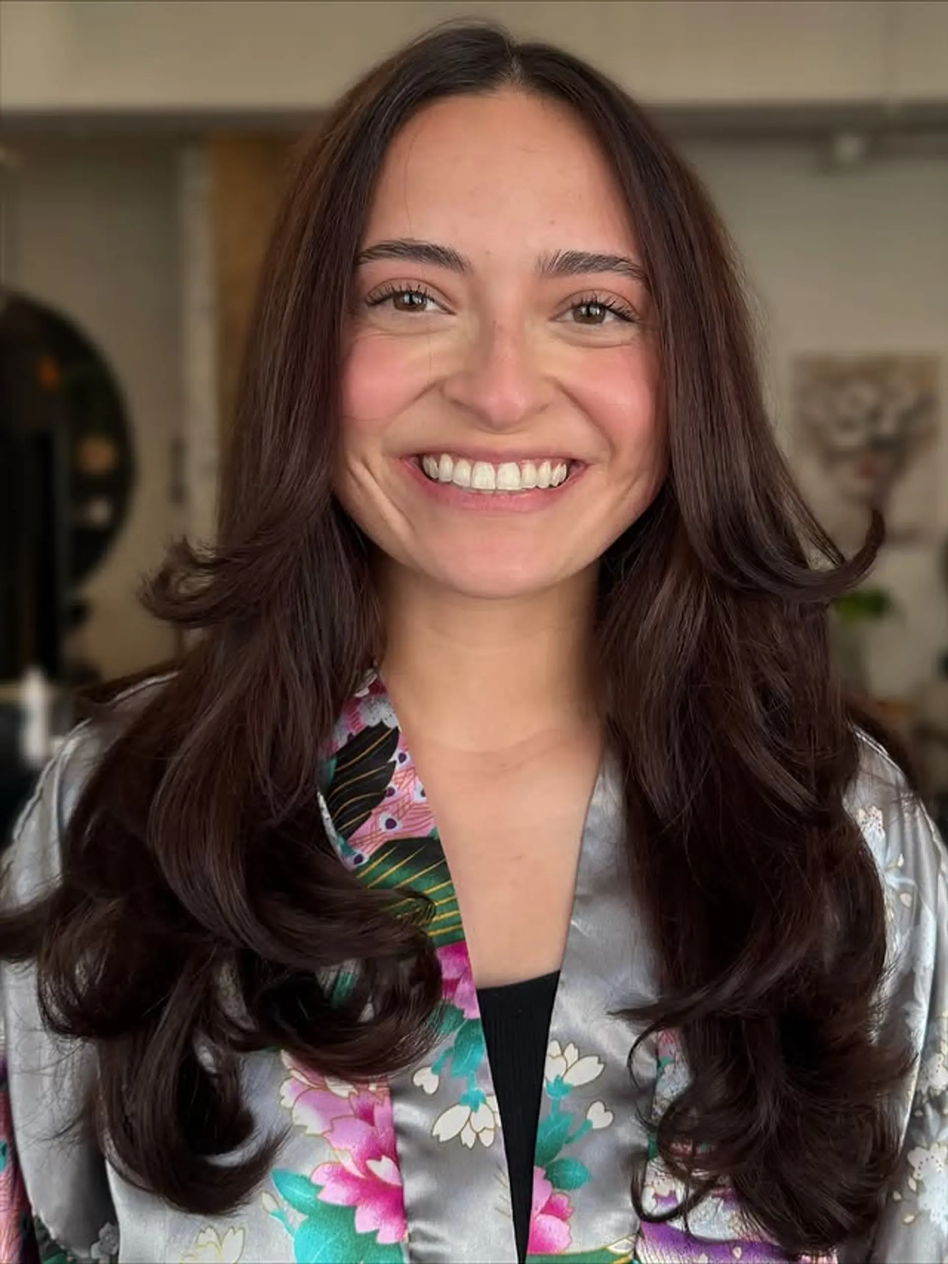 Long layered haircut with face framing layers. 1