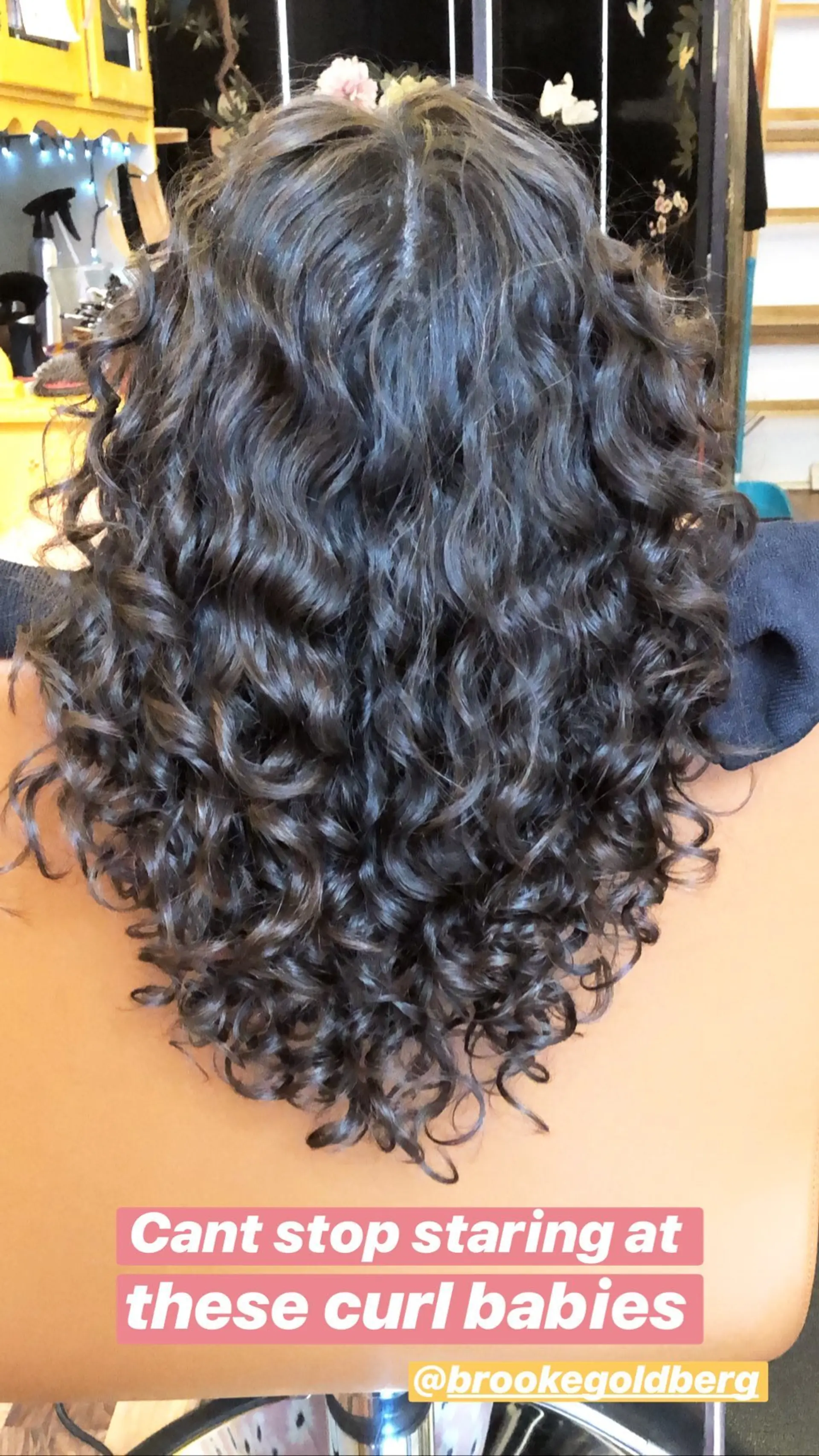 A curly hairstyle with well-defined, bouncy ringlets. 1