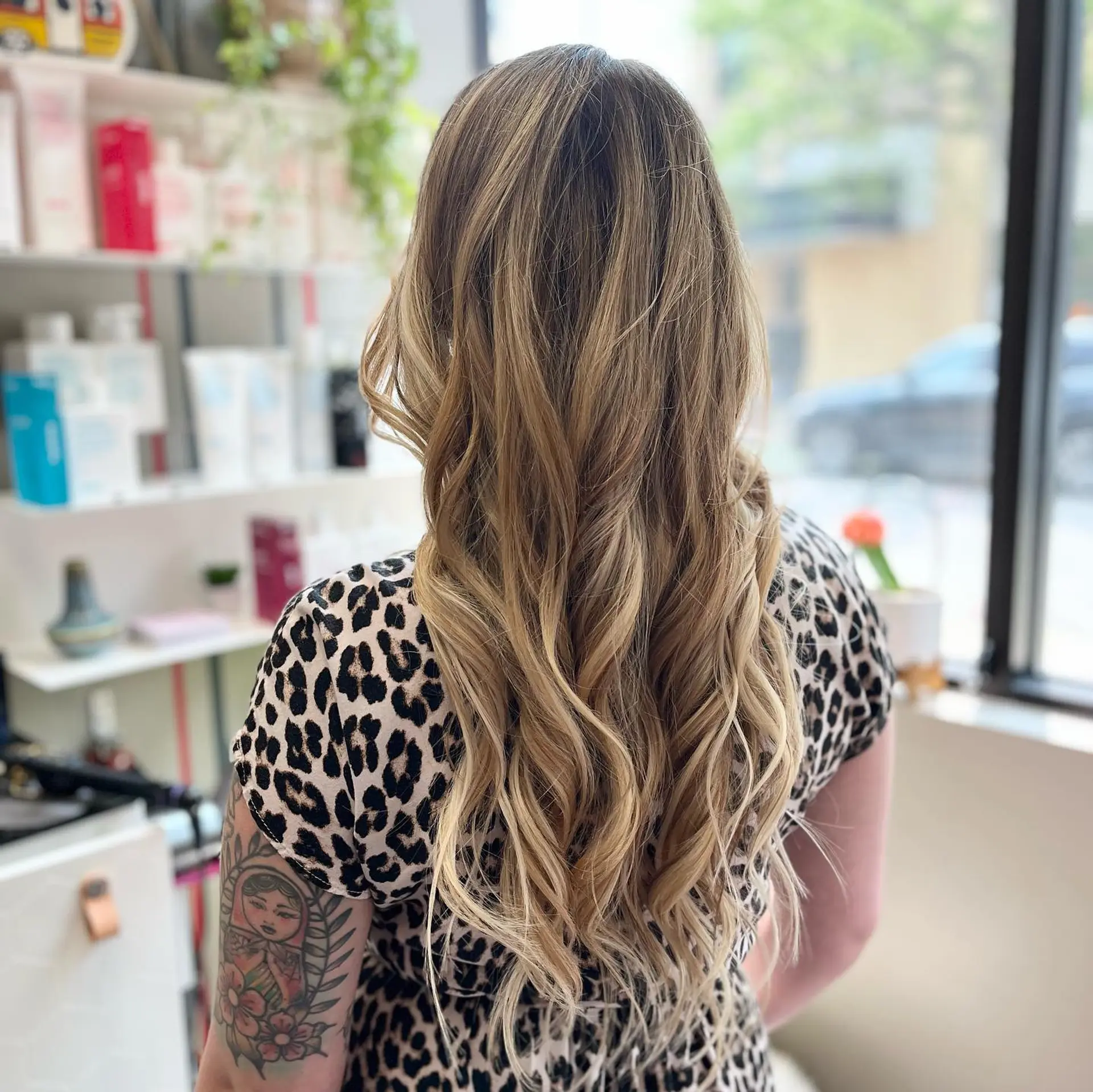 Long, flowing waves with a sun-kissed golden blonde balayage. 2