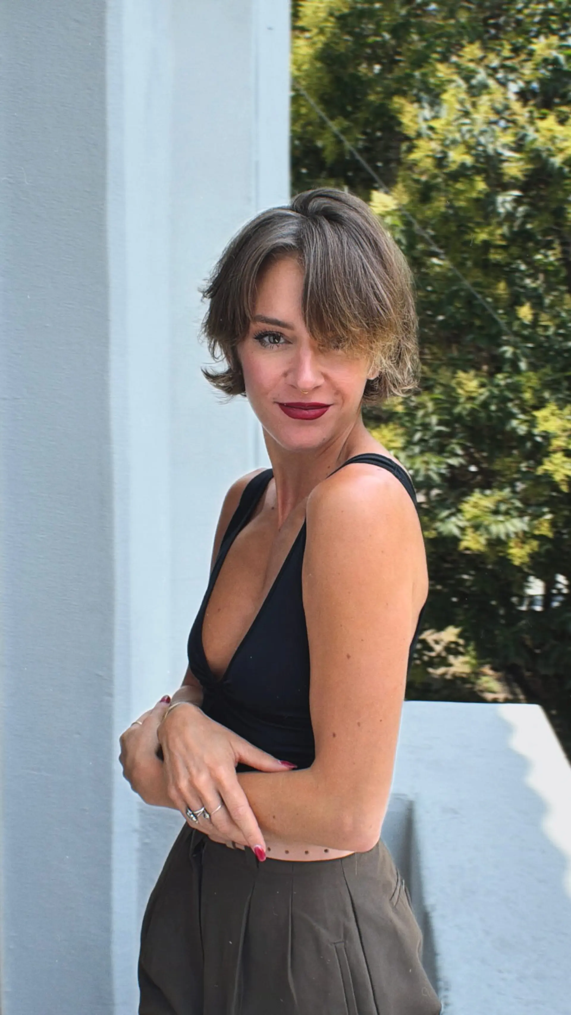A textured bixie haircut featuring piecey, face-framing layers and side-swept fringe with soft flicks at the nape and sides. 1