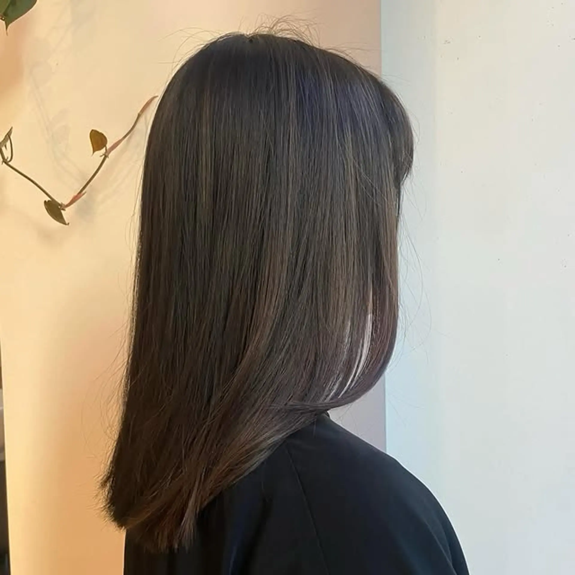 A sleek, medium-length bob with layers and trendy baby bangs. 1