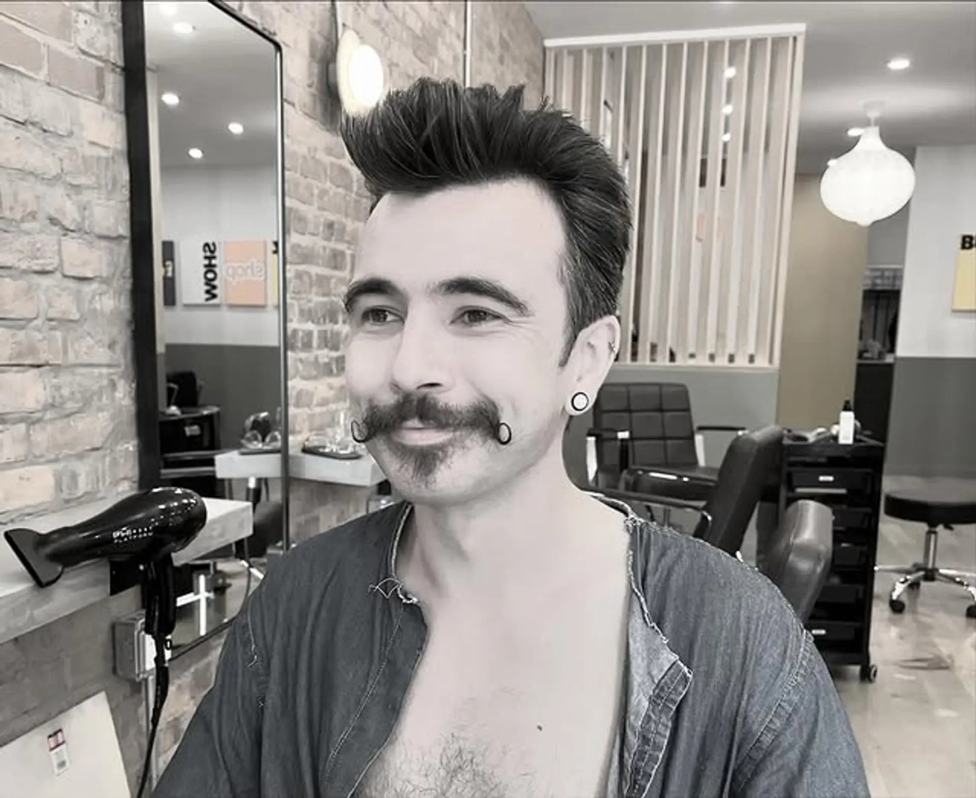 A pompadour with faded sides and high volume at the front. 1