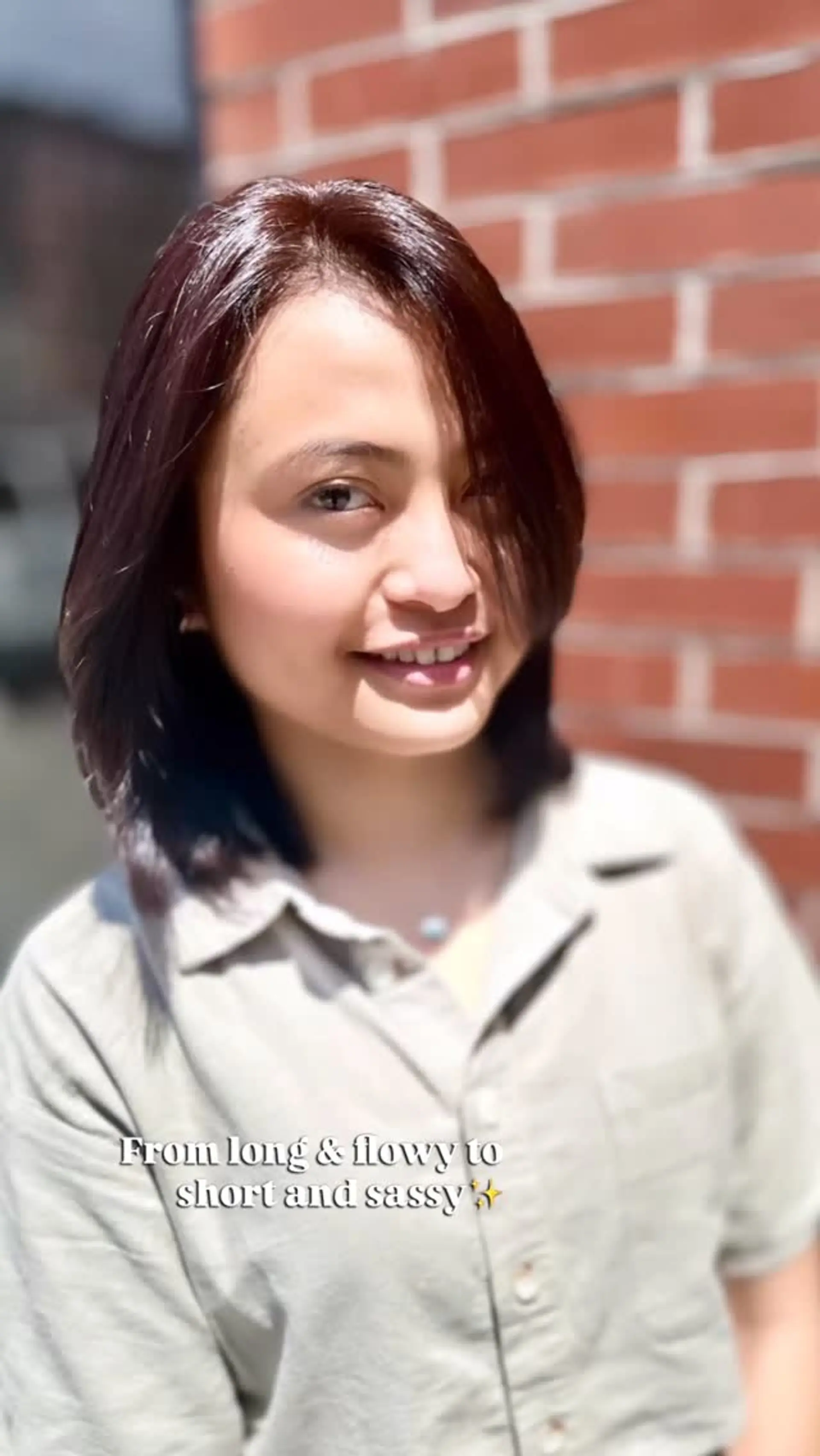 A textured, shoulder-length bob cut with soft layers and side-swept face-framing strands. 1