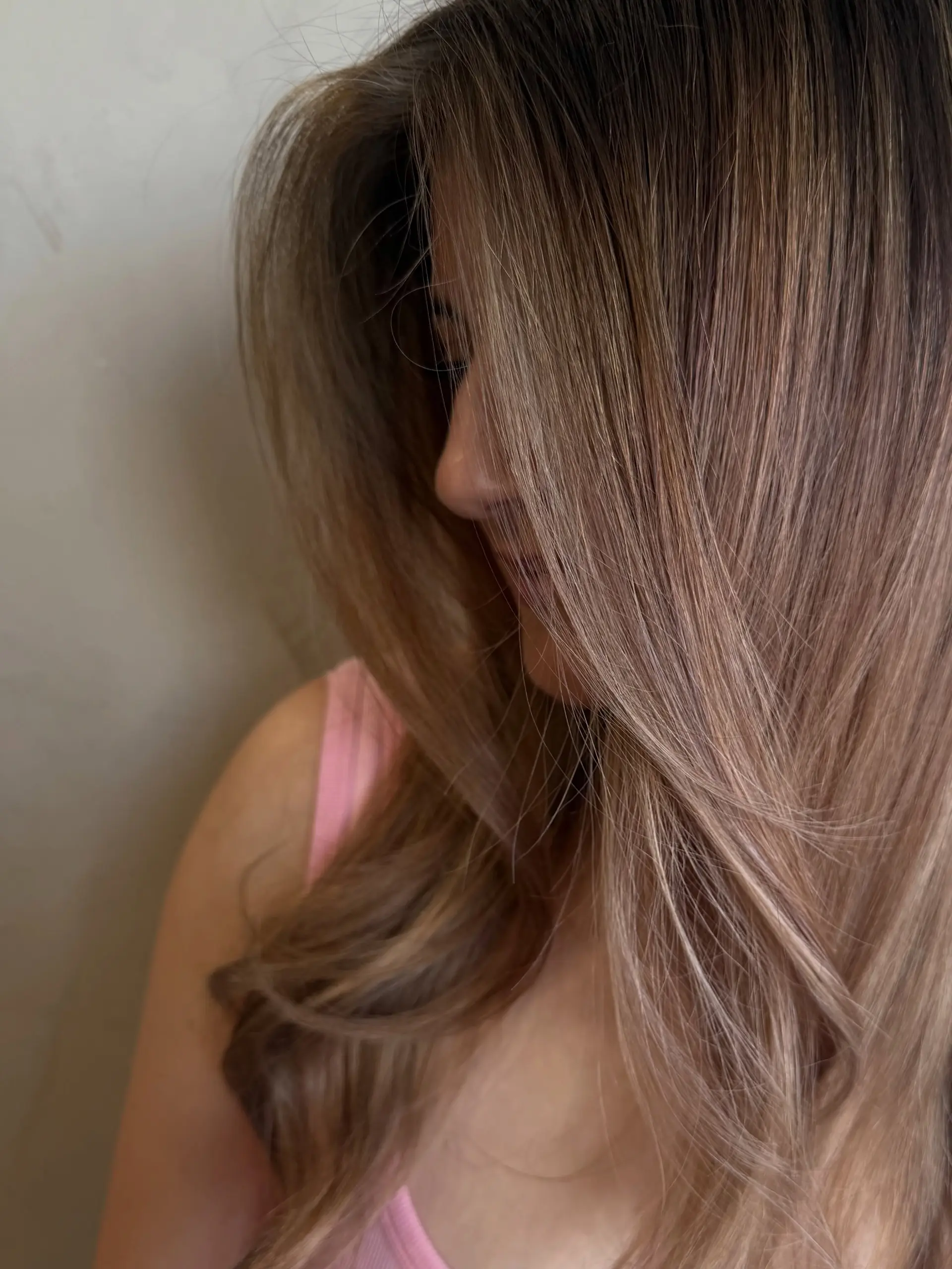 Long hair featuring a seamless, dimensional balayage with cool ash blonde highlights blended over a darker natural base. 1
