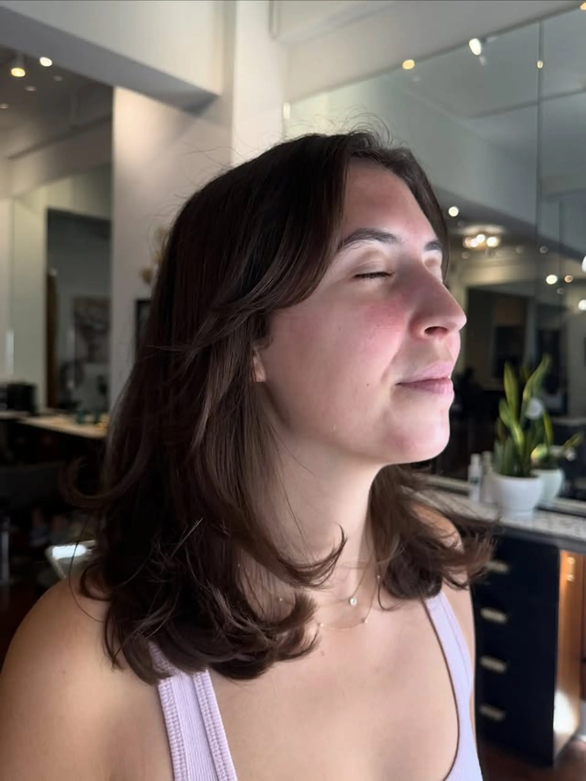 A modern shag haircut with face-framing layers and curtain bangs. 1