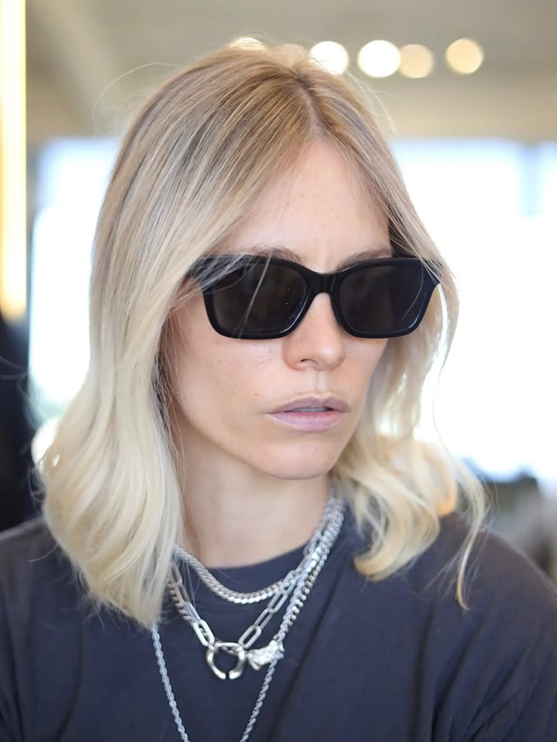 A medium-length wavy hairstyle with soft, natural-looking waves, perfect for a relaxed and effortless look. 1