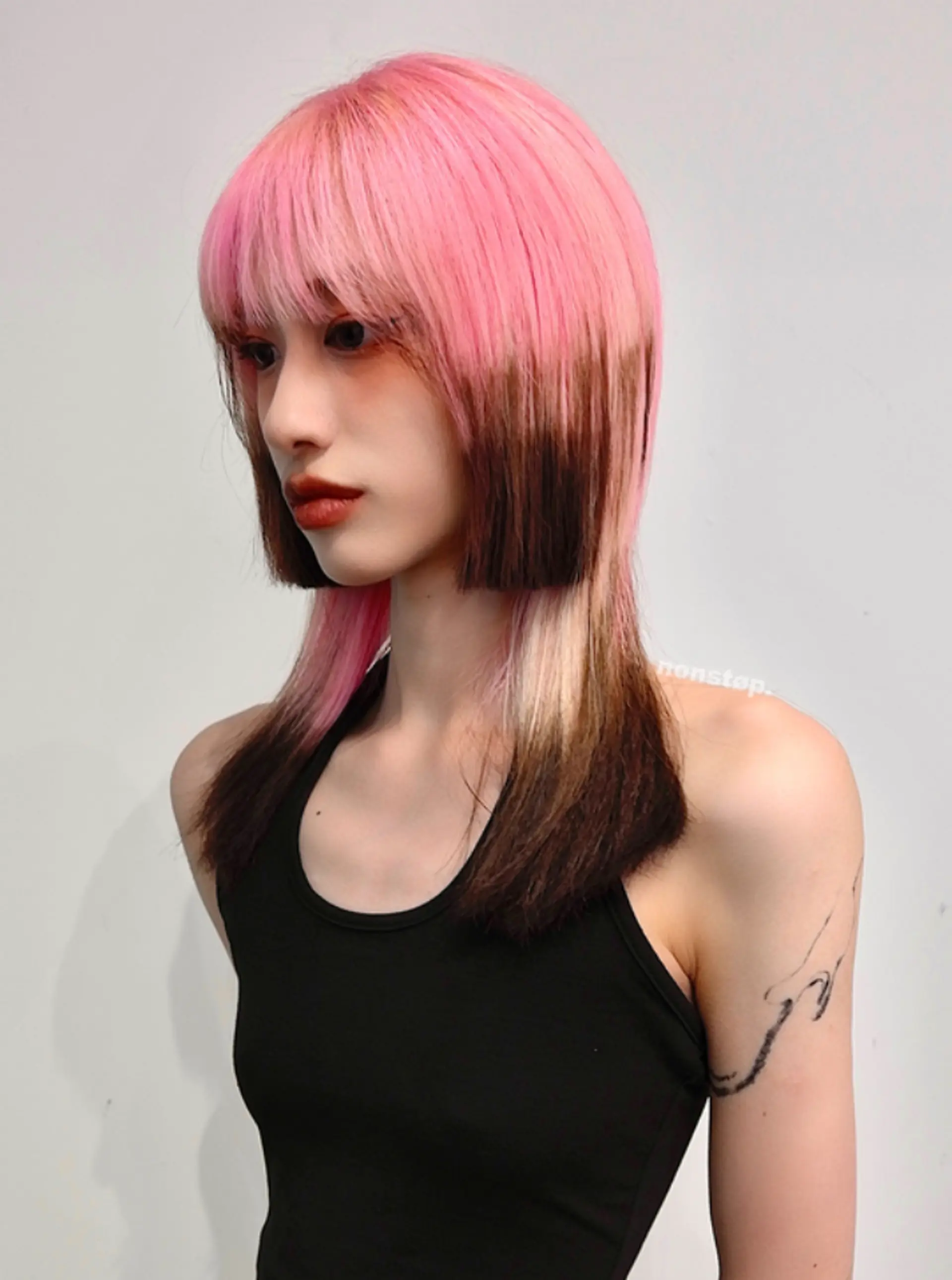 Medium-length straight hairstyle with a pink, black, and blonde ombre effect, featuring a thick fringe and edgy, choppy layers.

(NonstopStyle: by Vincent) 1