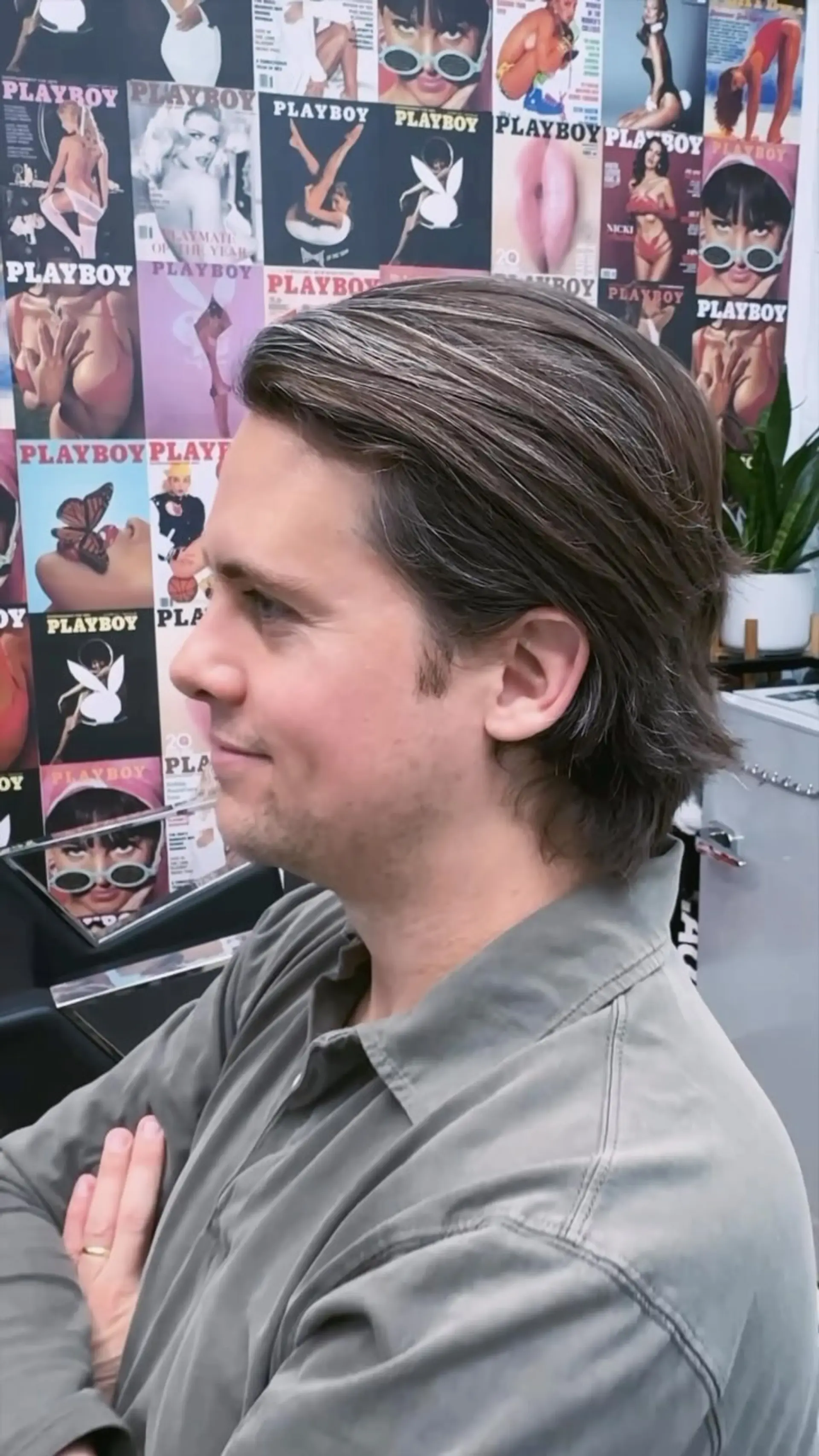 A medium-length men's haircut swept back with natural flow and soft, tapered layers. 1