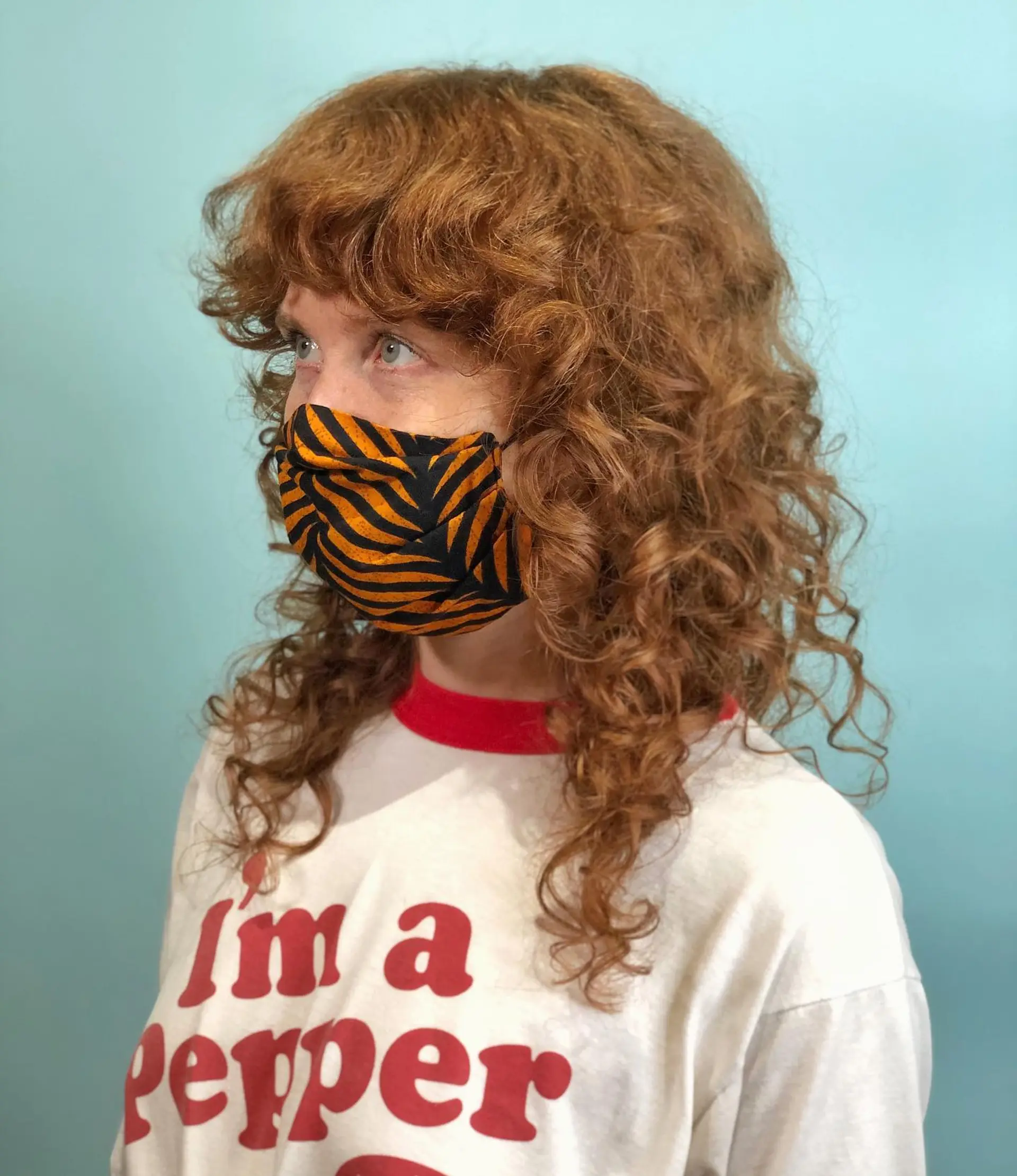 A medium-length curly shag with layered texture and face-framing bangs. 1