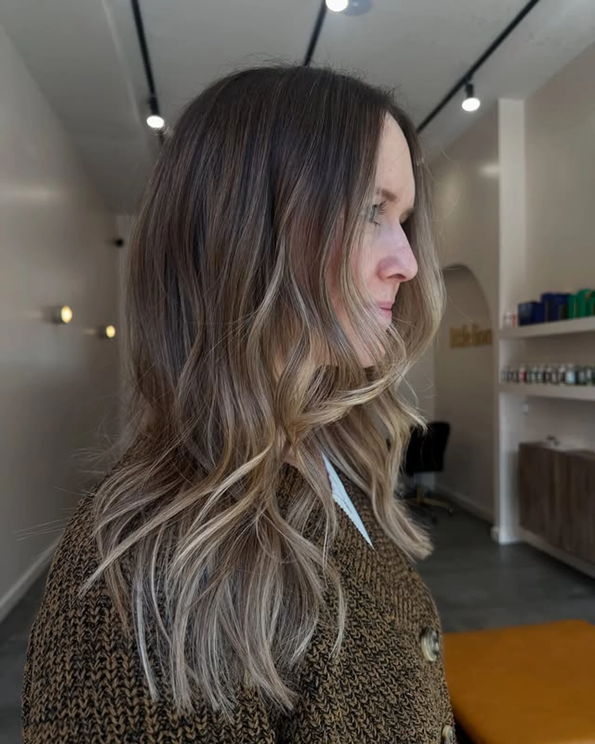 Long, wavy hair with a stunning blonde balayage, creating a dimensional and beachy look. - Preview 3